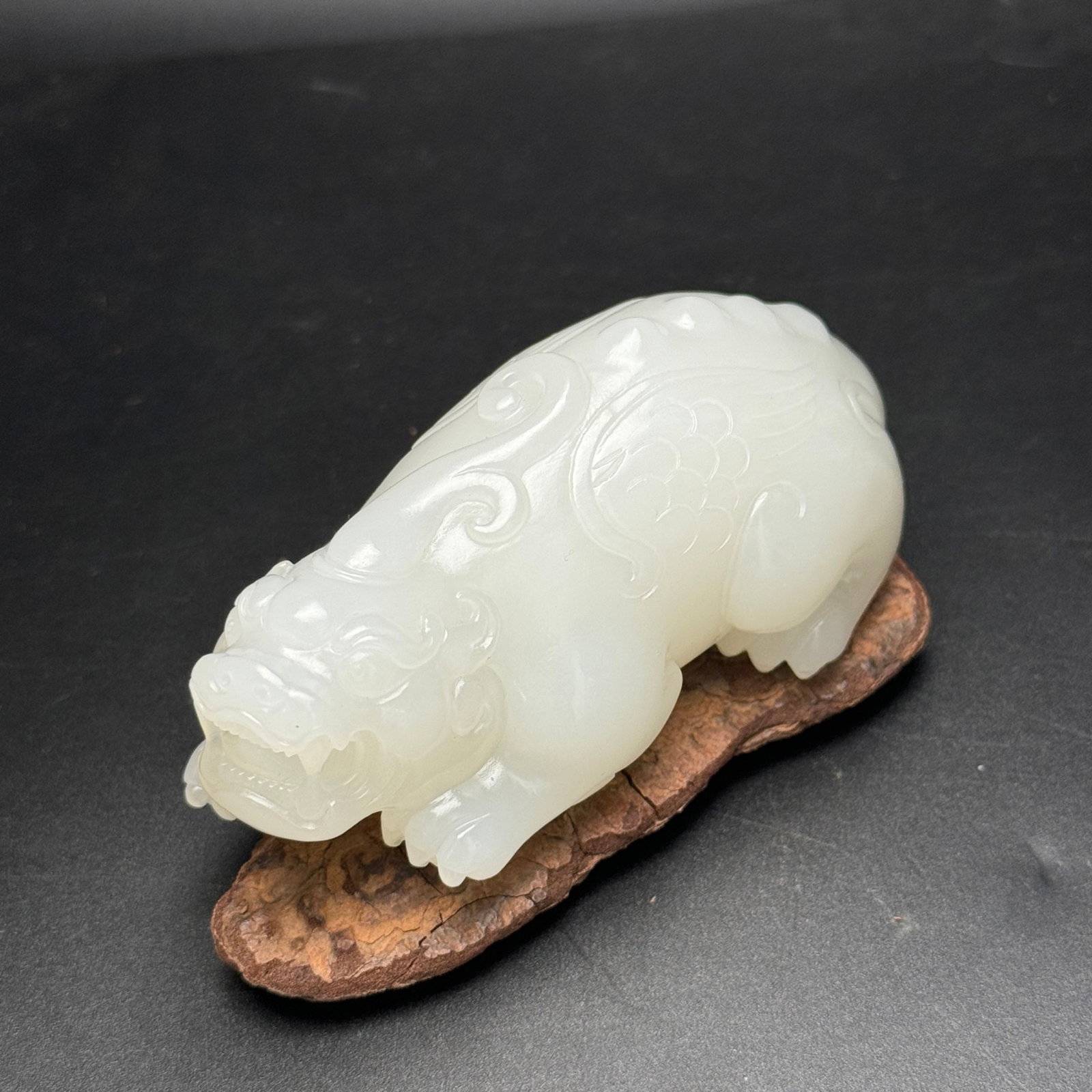 An Exquisite White Jade Auspicious Beast Ornament: Estimated Value:5600-12000 An Exquisite White Jade Auspicious Beast Ornament,Qing Dynasty,China,Size:97mmx49mmx41mm,Weight:261g