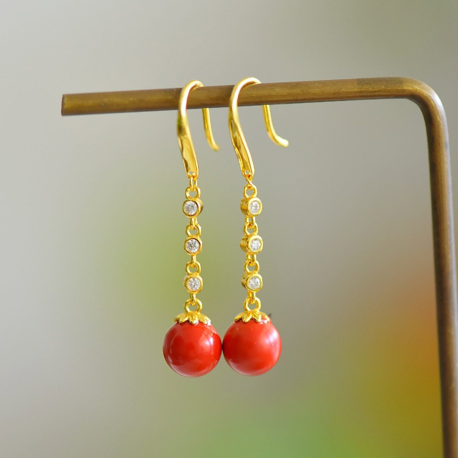 A Pair of Exquisite Sterling Silver-Gold Plated Inlaid Cinnabar Earrings,Inlaid Diamond: Estimated Value:200-400 A Pair of Exquisite Sterling Silver-Gold Plated Inlaid Cinnabar Earrings,Inlaid Diamond,Size:8mmx8mm 寓意:平安好运