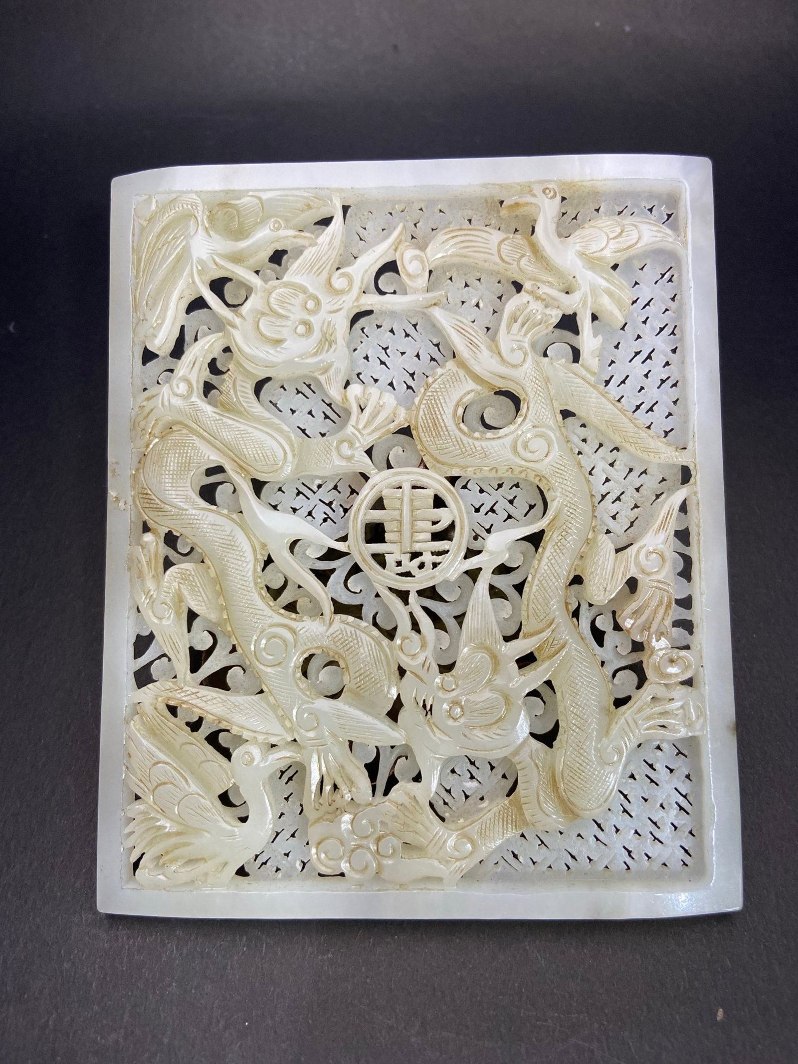 An Exquisite White Jade Crane Dragon Pattern Ornament: Estimated Value:2800-5600 An Exquisite White Jade Crane Dragon Pattern Ornament,Qing Dynasty,China,Size:136mmx113mmx8.3mm,Weight:227g 白玉鹤龙纹摆件,中&