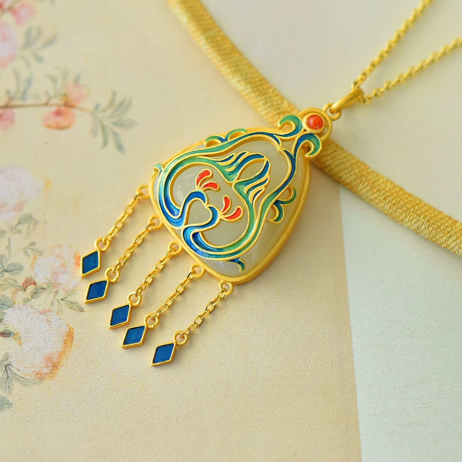 An Exquisite Sterling Silver-Gold Plated Inlaid White Jade Enamel Pendant: Estimated Value:300-600 An Exquisite Sterling Silver-Gold Plated Inlaid White Jade Enamel Pendant 纯银镀金镶白玉珐琅吊坠