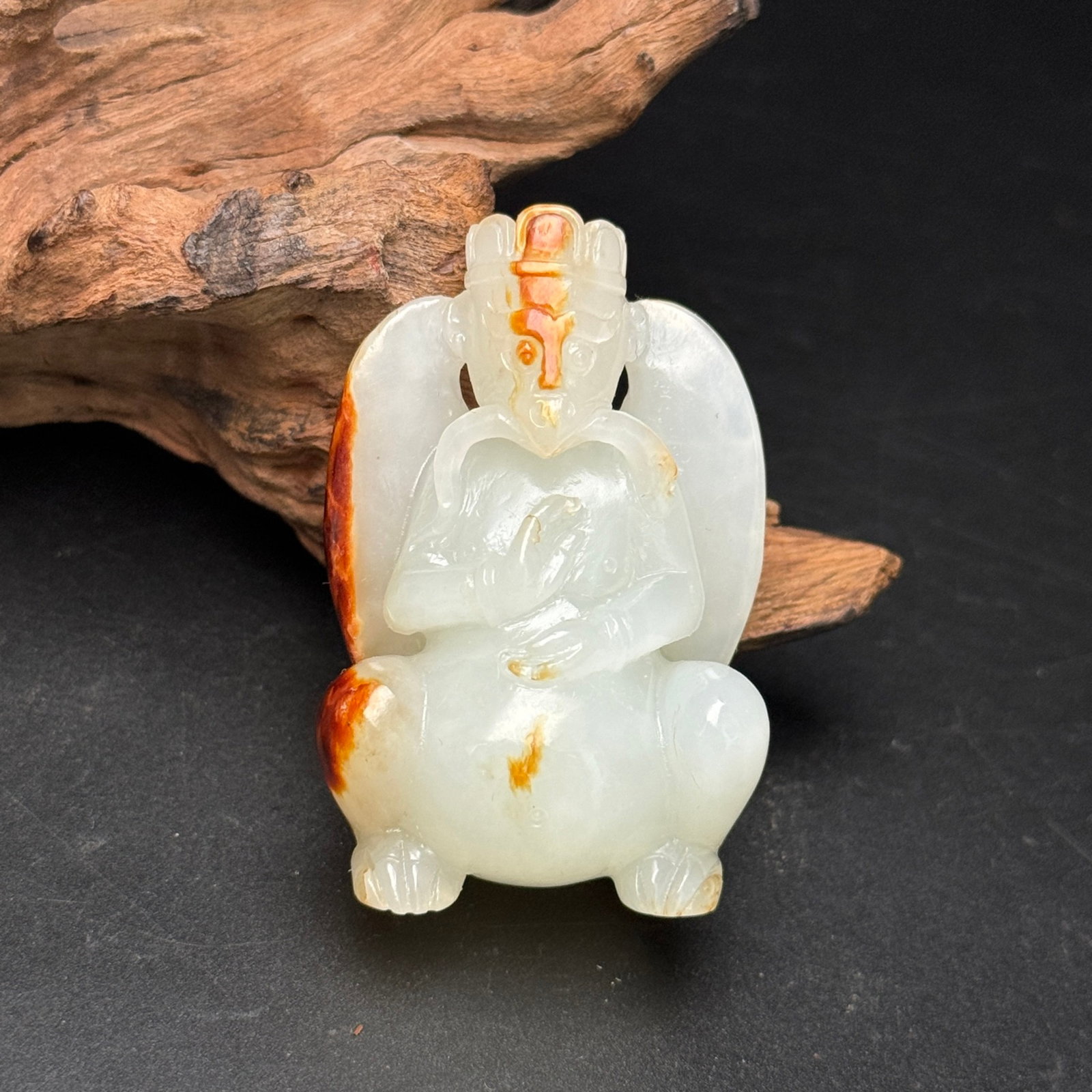 An Exquisite White Jade Statue of Garu?a Pendant: Estimated Value:1100-2200 An Exquisite White Jade Statue of Garuḍa Pendant,Qing Dynasty,China,Size:35mmx53mmx24mm,Weight:52g