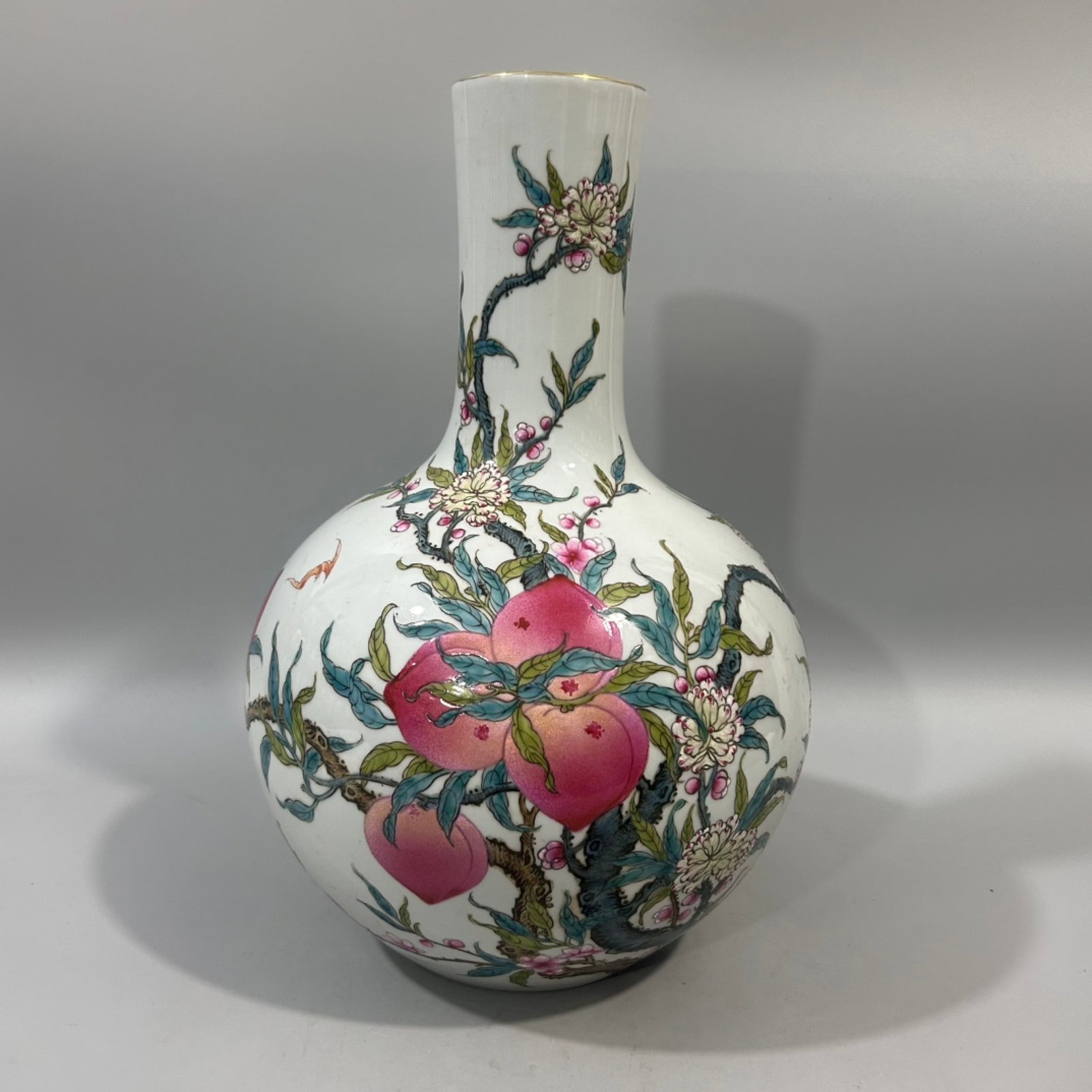 A Rare Famille-Rose Painted Gold Bats and Peach Pattern Vase: Estimated Value:2400-4800 A Rare Famille-Rose Painted Gold Bats and Peach Pattern Vase,Qing Dynasty,China,Yongzheng Six-character Mark,Size:6.7inx13.2in