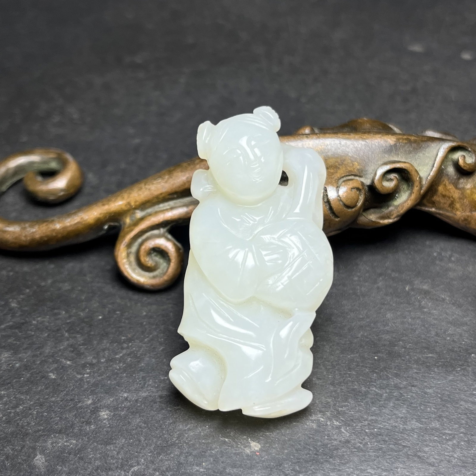 An Exquisite White Jade Figure Pendant: Estimated Value:400-800 An Exquisite White Jade Figure Pendant,Qing Dynasty,China,Size:47mmx12mmx22mm,Weight:19g 白玉人物挂件,中国清代