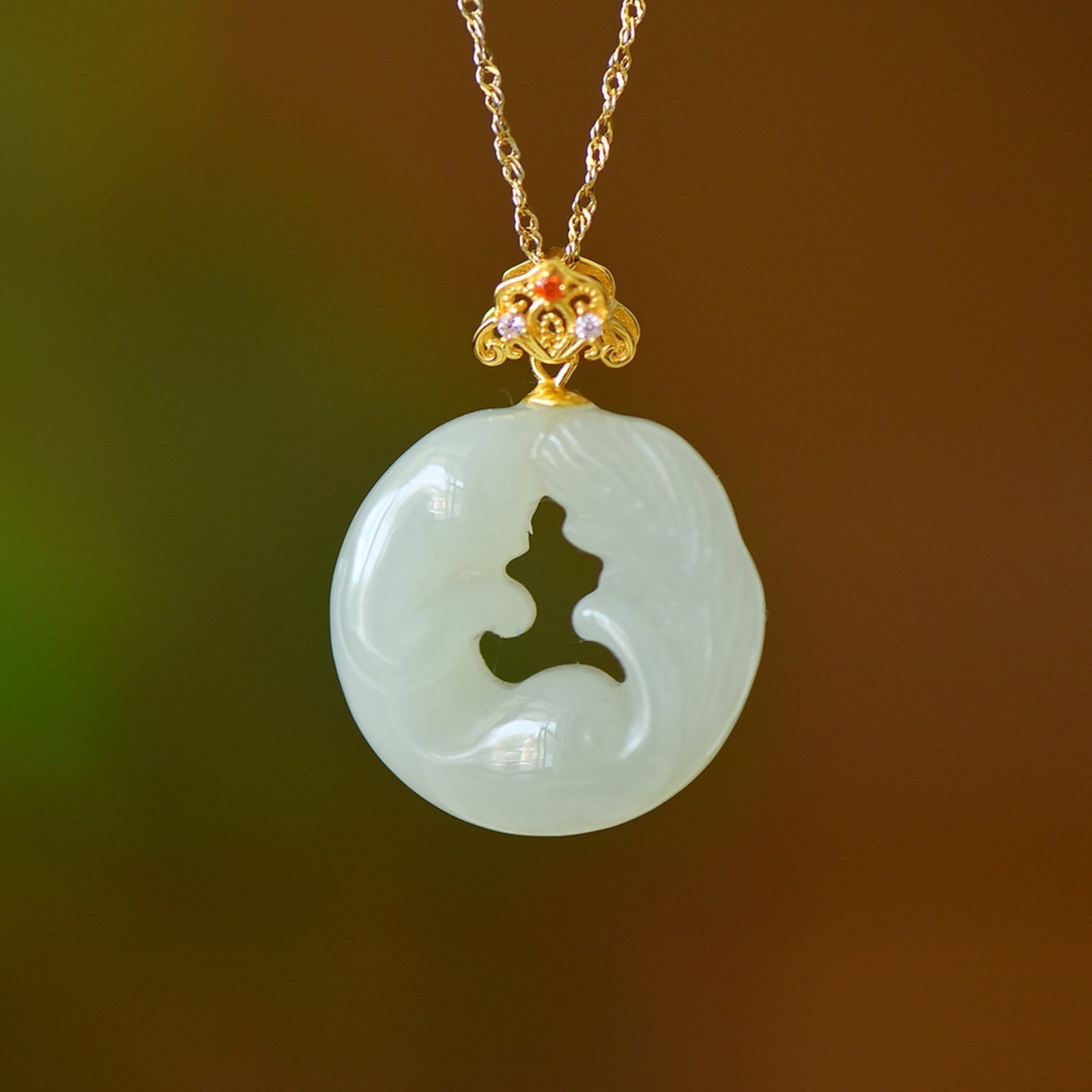 An Exquisite Sterling Silver-Gold Plated Inlaid White Jade Pendant,Inlaid Gems: Estimated Value:600-1200 An Exquisite Sterling Silver-Gold Plated Inlaid White Jade Pendant,Inlaid Gems Size:24mmx24mm 纯银镀金镶白玉吊坠,嵌