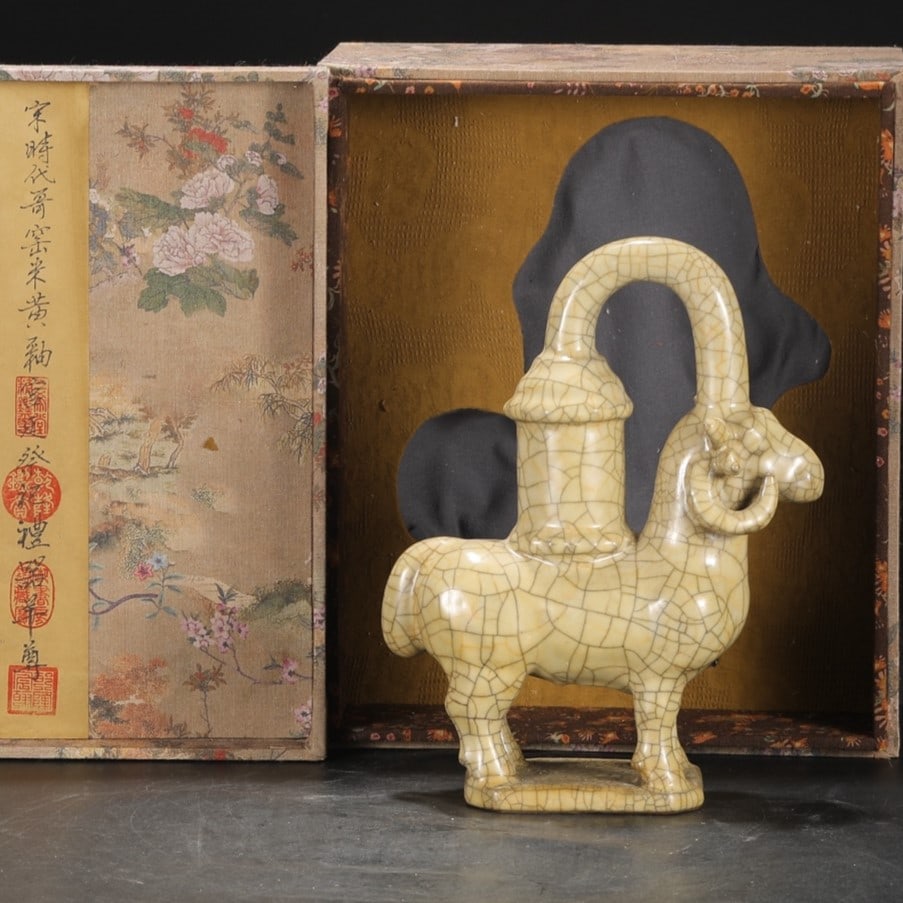 A Exquisite Ge yao Rice Yellow Glazed Sheep-Shaped Vase: A Exquisite Ge yao Rice Yellow Glazed Sheep-Shaped Vase,Song Dynasty, China,With Mark,Size:10.4inx7.9in 哥窑米黄釉羊形瓶,中国宋代