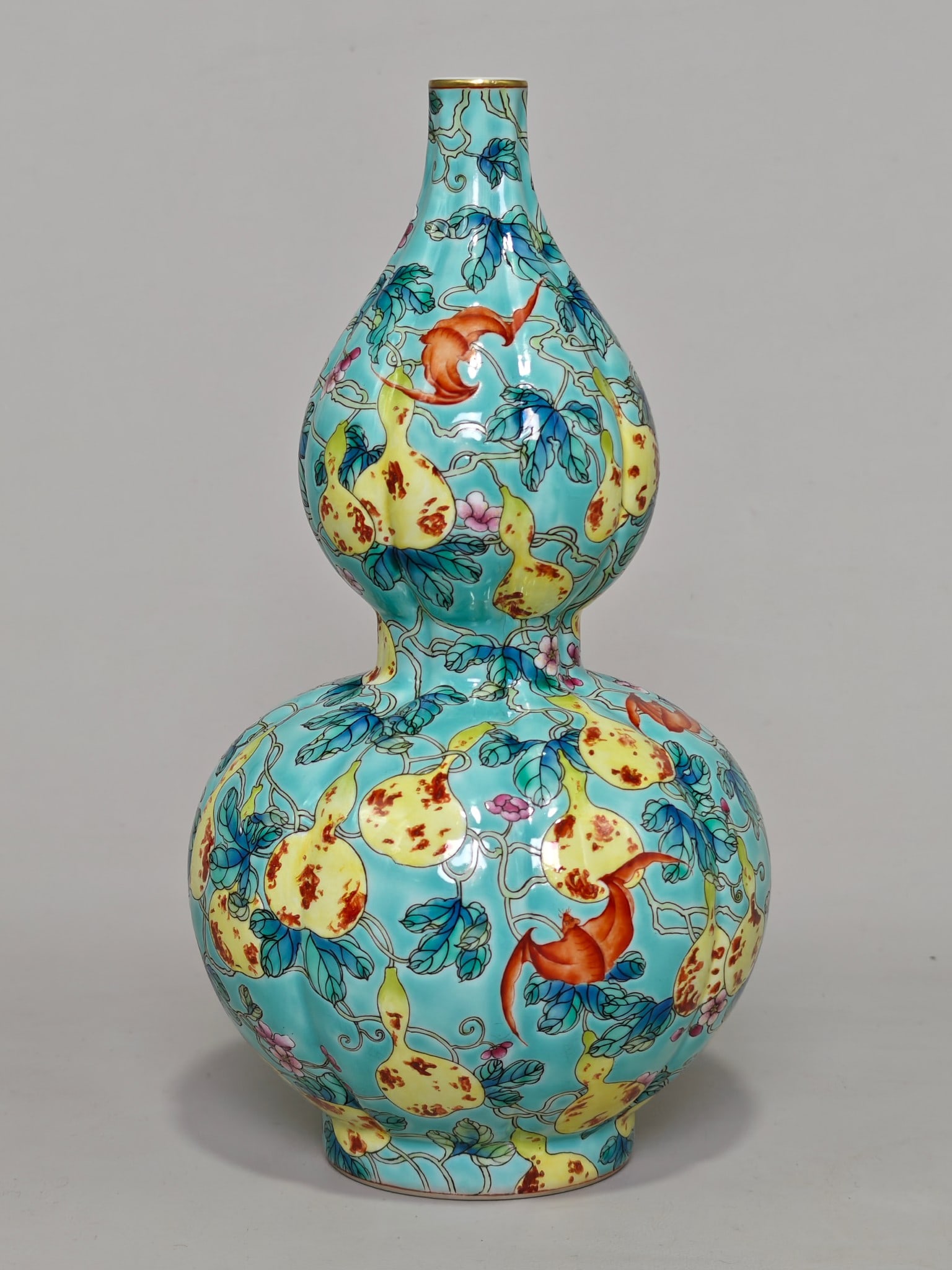 A Exquisite Turquoise-Glazed Ground Famille-Rose Bat Pattern Gourd-Shaped Vase: A Exquisite Turquoise-Glazed Ground Famille-Rose Bat Pattern Gourd-Shaped Vase,Qing Dynasty, China,Qianlong Six-character Mark,Size:9.8inx5.5in