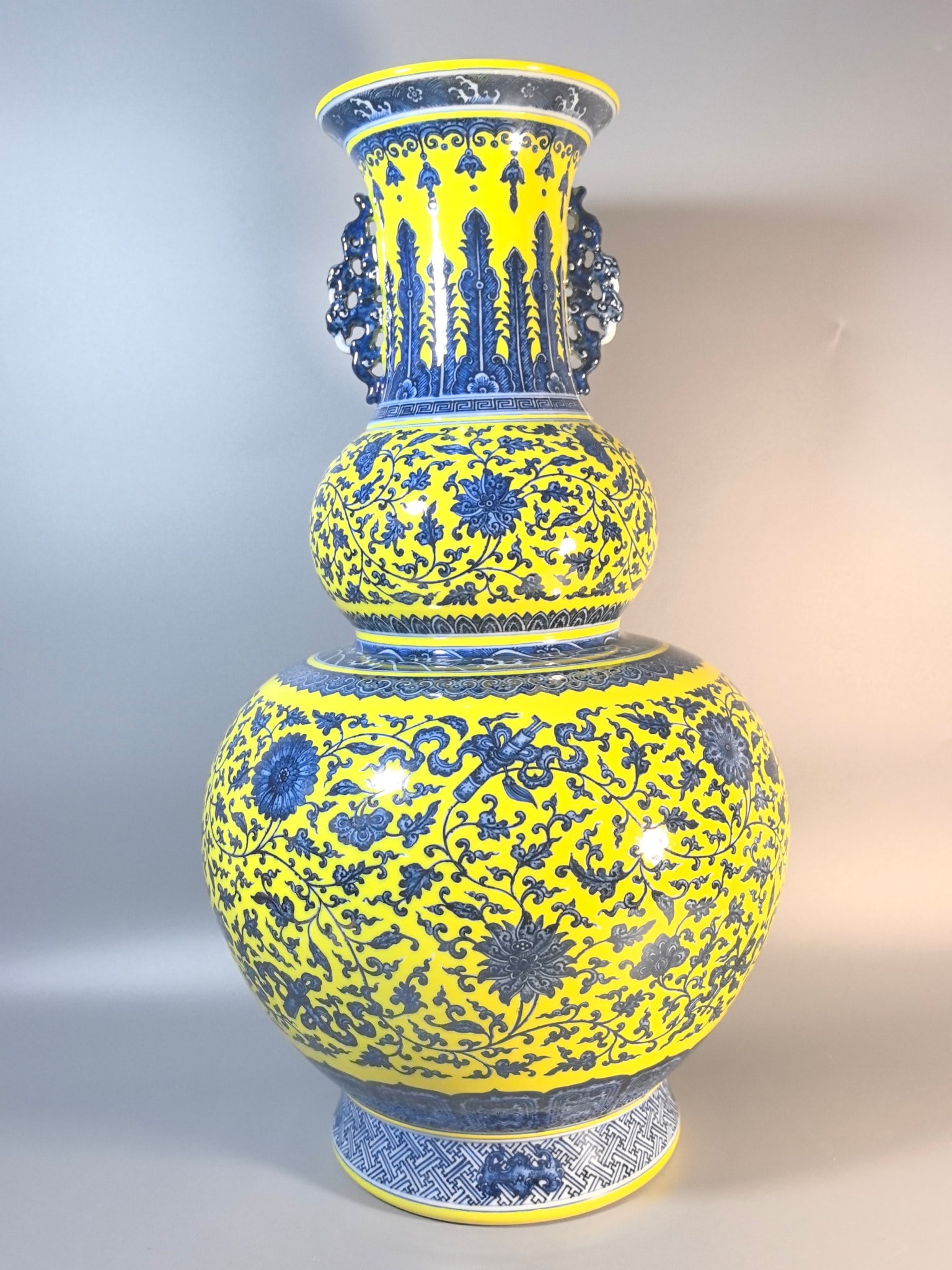 A Exquisite Yellow Ground Blue and White Lotus Eight Treasures Pattern Double-Ears Gourd Vase: A Exquisite Yellow Ground Blue and White Lotus Eight Treasures Pattern Double-Ears Gourd Vase,Qing Dynasty, China,Qianlong Six-character Mark,Size:24inx6.7inx13.8inx8.3in