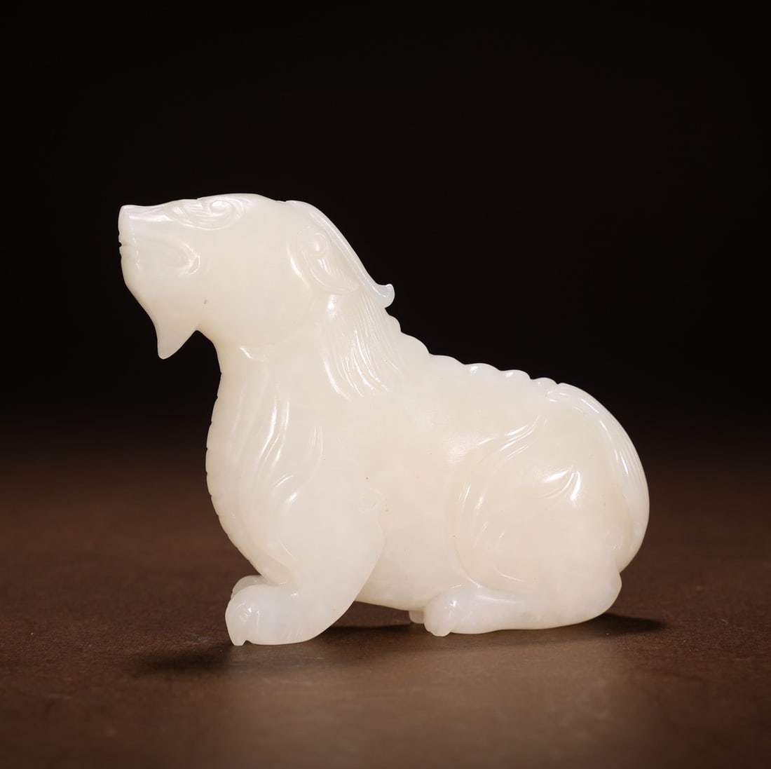 A Exquisite Hotan Jade Auspicious Beast Ornament: A Exquisite Hotan Jade Auspicious Beast Ornament,Qing Dynasty, China,Size:2.8inx0.7inx2.4in,Weight:100g 和田玉瑞兽摆件,中国清代
