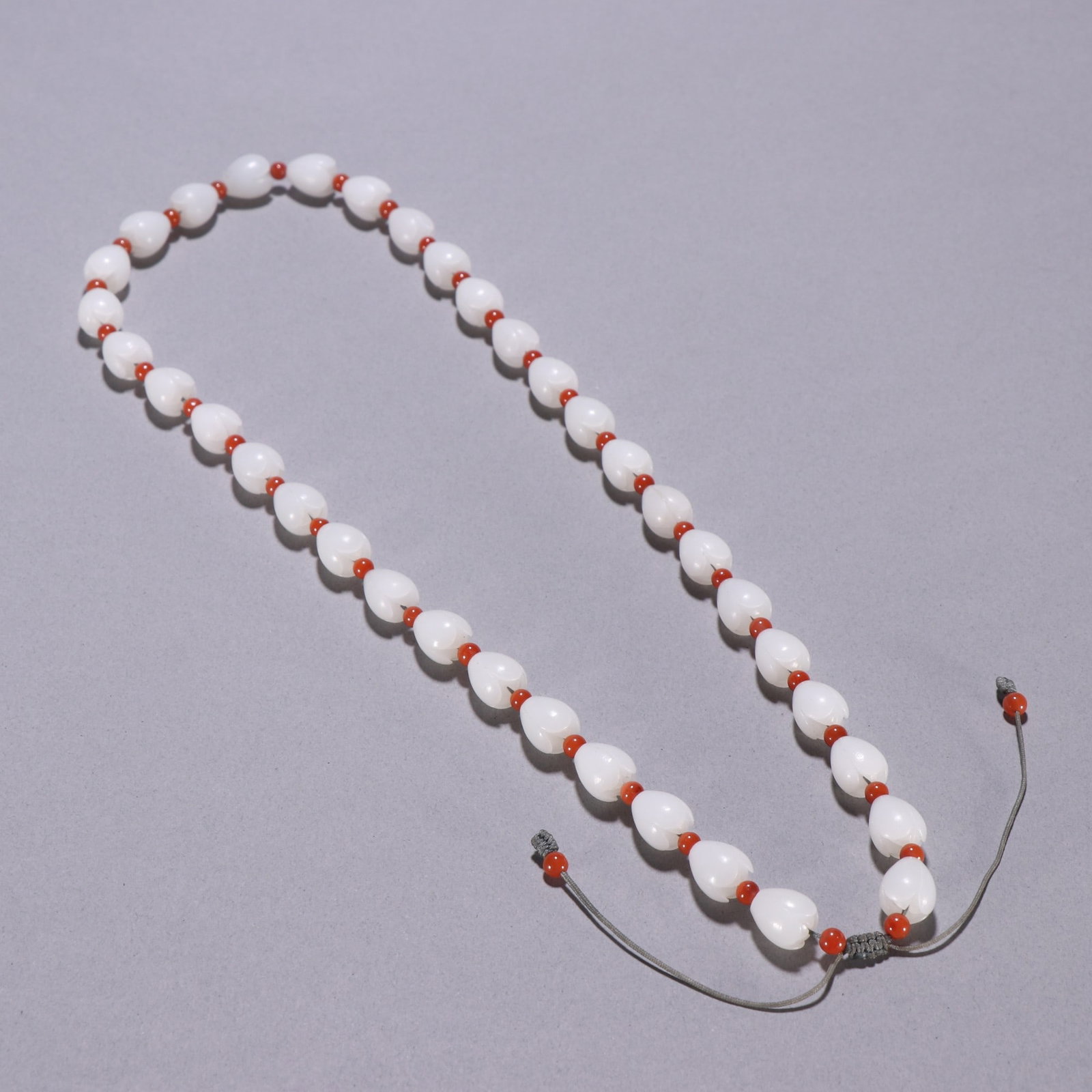 A Exquisite Hotan Jade Necklace: A Exquisite Hotan Jade Necklace,Qing Dynasty, China,Size:0.5inx0.4in,Weight:73.5g 和田玉项链,中国清代