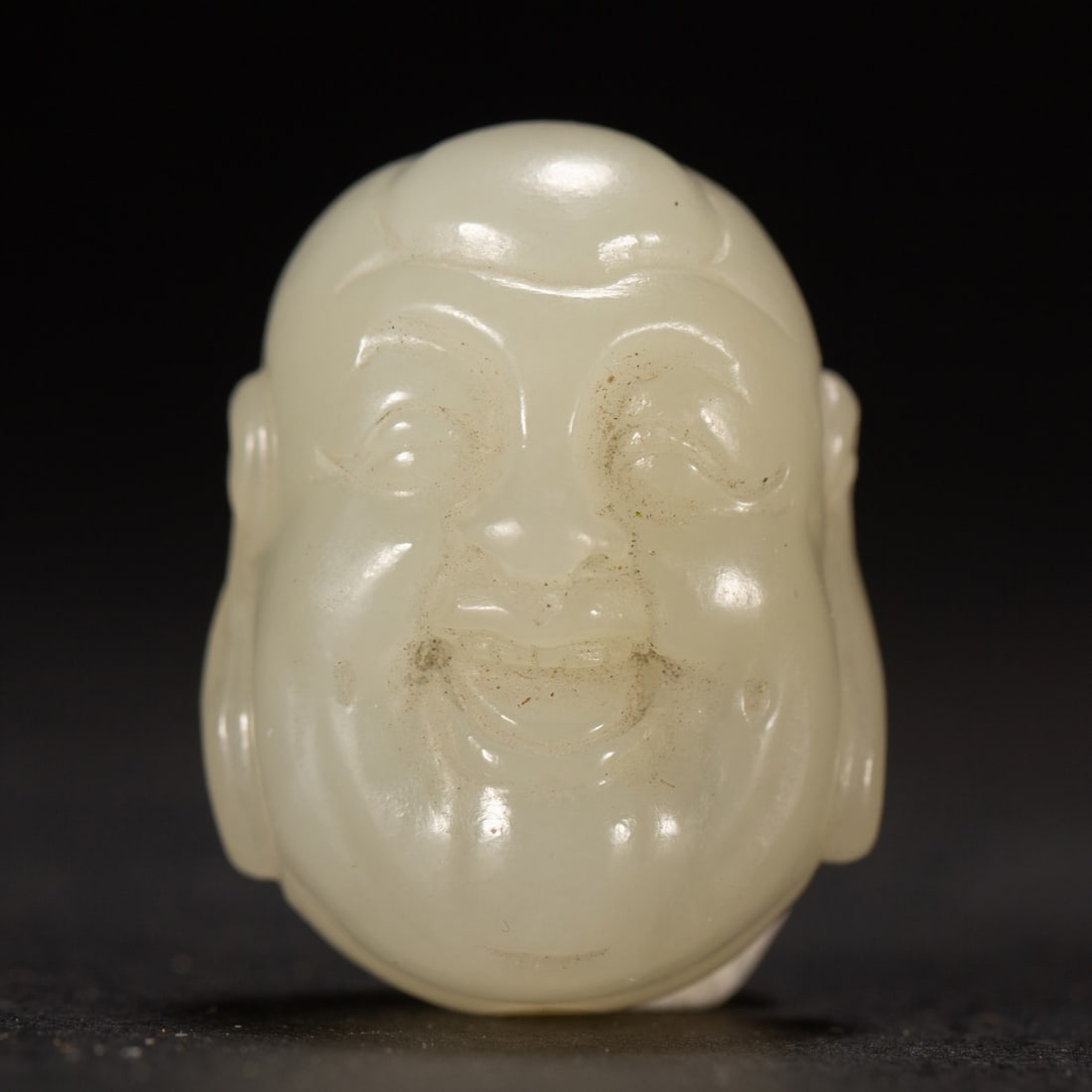 A Exquisite Hotan Jade Buddha head: A Exquisite Hotan Jade Buddha head,Qing Dynasty, China,Size:1inx1.4in,Weight:30g 和田玉佛头,中国清代