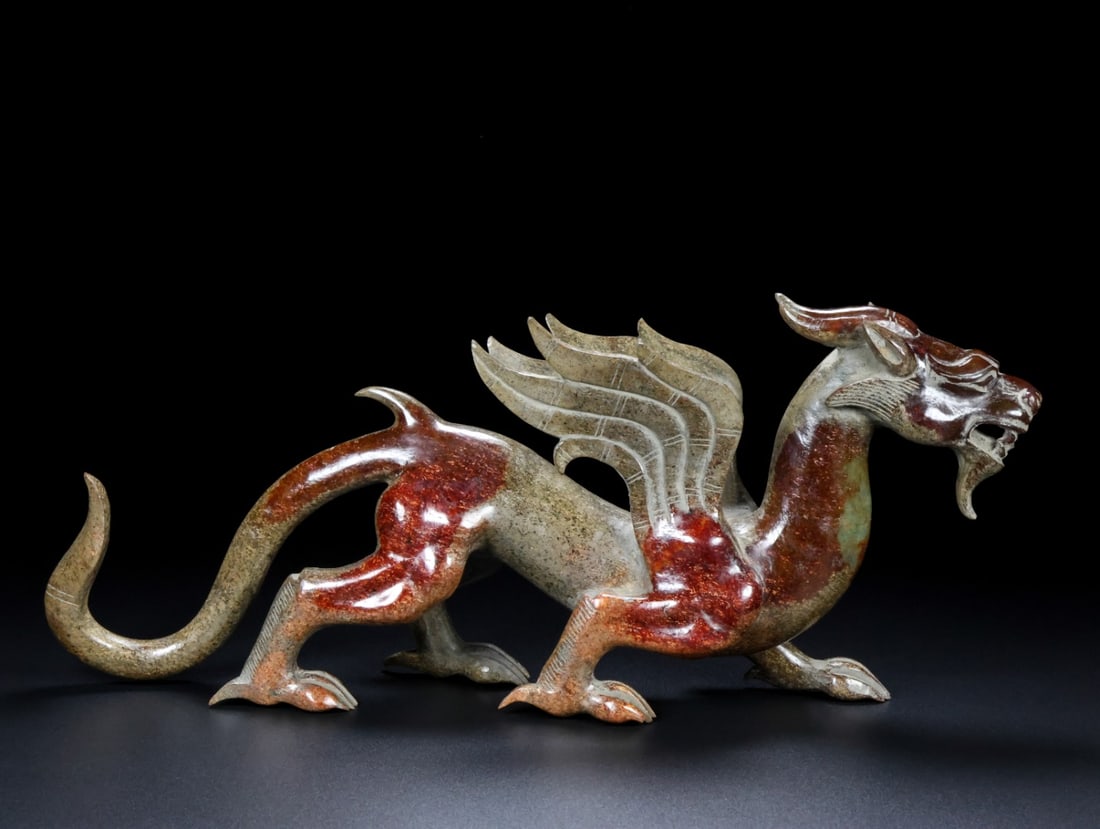 A Exquisite Hotan Jade Auspicious Beast Ornament: A Exquisite Hotan Jade Auspicious Beast Ornament,Han Dynasty, China,Size:13.4inx2.4inx5.9in,Weight:1487g 和田玉瑞兽摆件,中国汉代