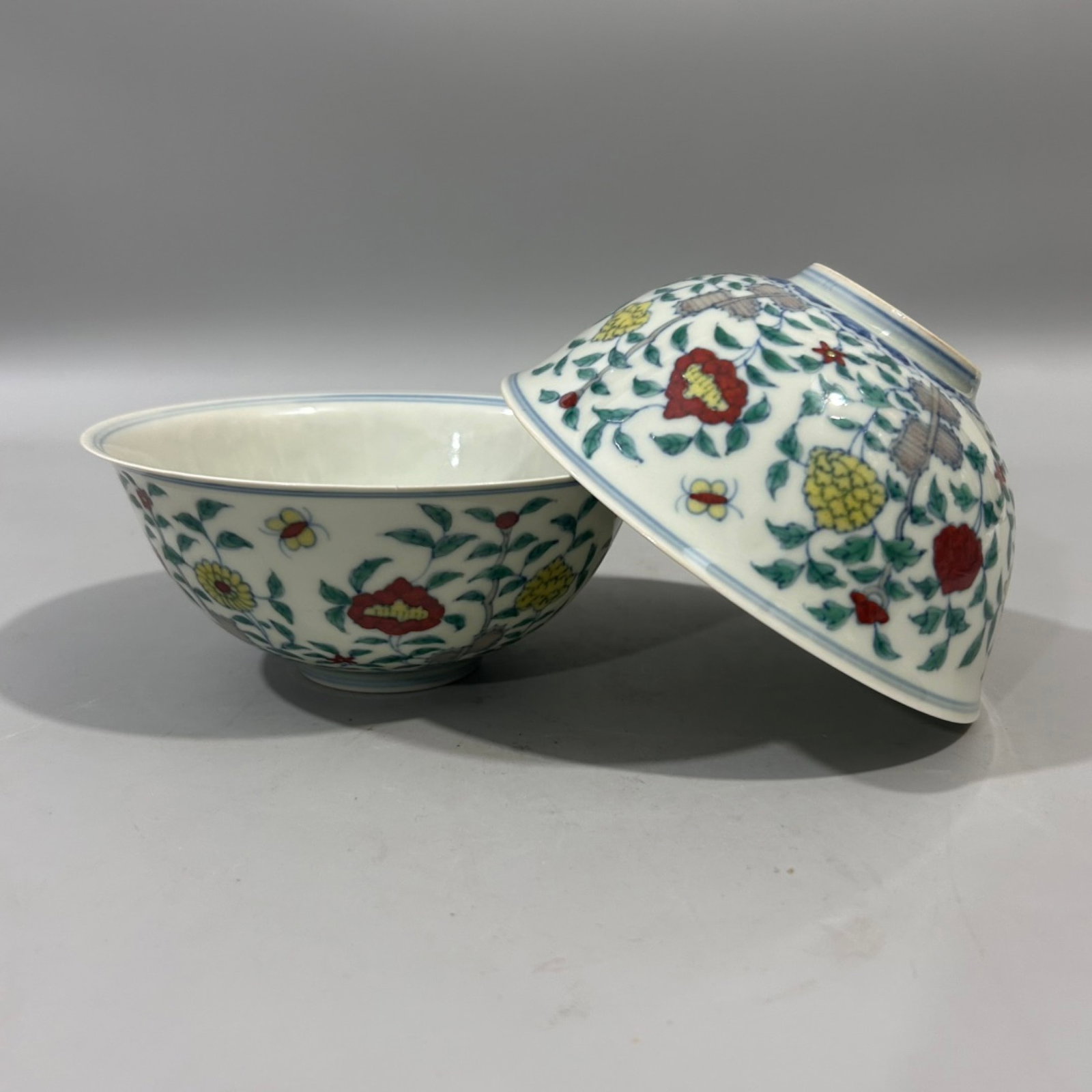 A Pair of Exquisite Doucai Flower Pattern Bowls: Estimated Value:1600-3200 A Pair of Exquisite Doucai Flower Pattern Bowls,Ming Dynasty,China,Chenghua Six-character Mark,Size:6.1inx2.8in