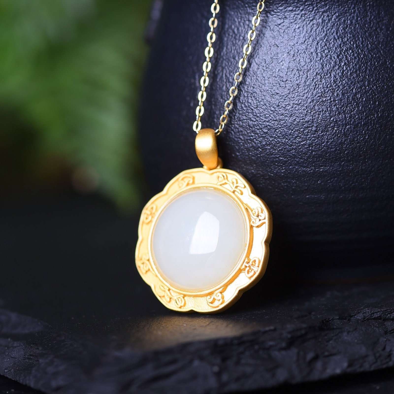 An Exquisite Sterling Silver-Gold Plated Inlaid White Jade Pendant: Estimated Value:200-400 An Exquisite Sterling Silver-Gold Plated Inlaid White Jade Pendant,Size:8mmx10mm 纯银镀金镶白玉吊坠