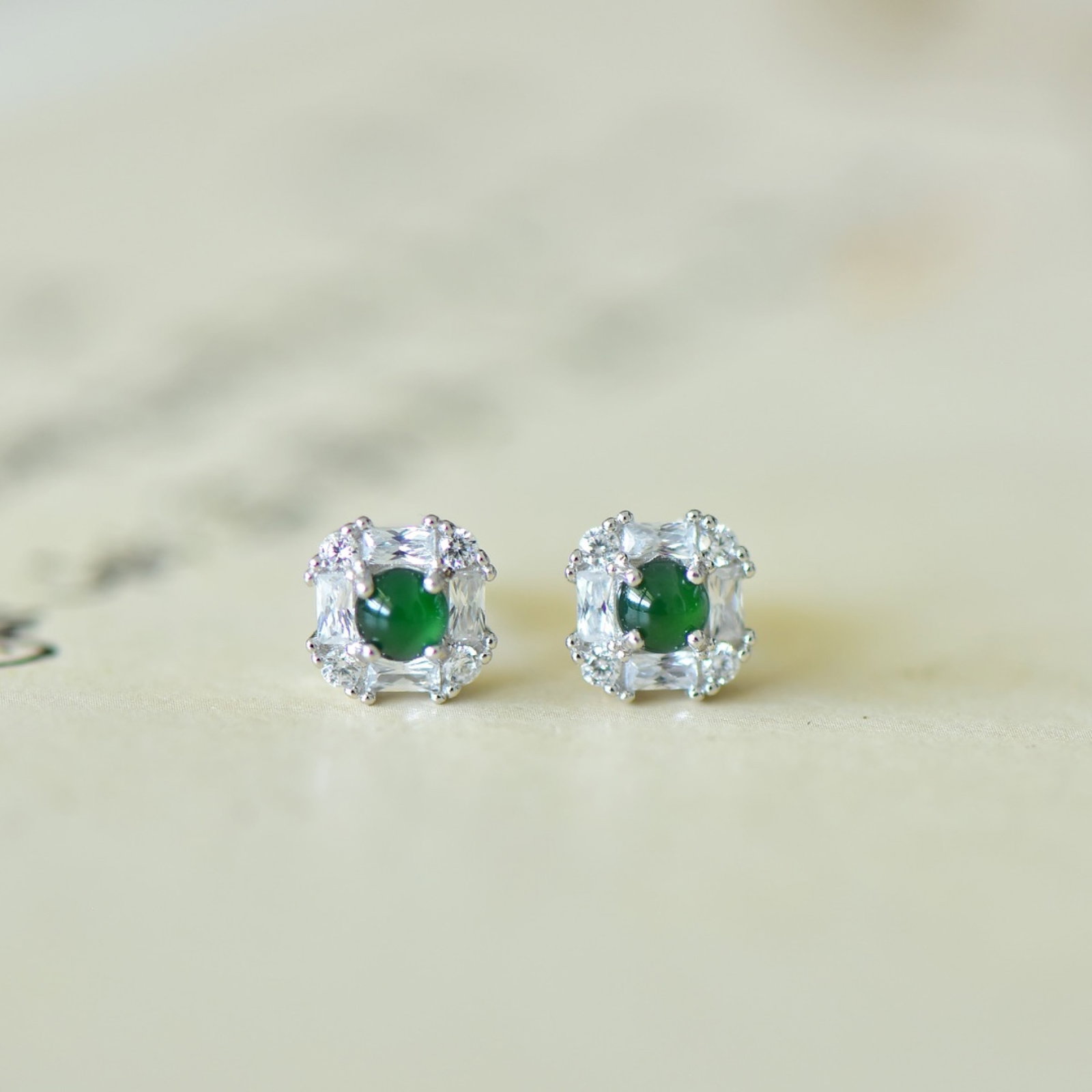 A Pair of Exquisite Sterling Silver Inlaid Jadeite Earrings,Inlaid Diamond: Estimated Value:200-400 A Pair of Exquisite Sterling Silver Inlaid Jadeite Earrings,Inlaid Diamond,Size:4mmx4mm 一对纯银镶翡翠耳钉,嵌钻