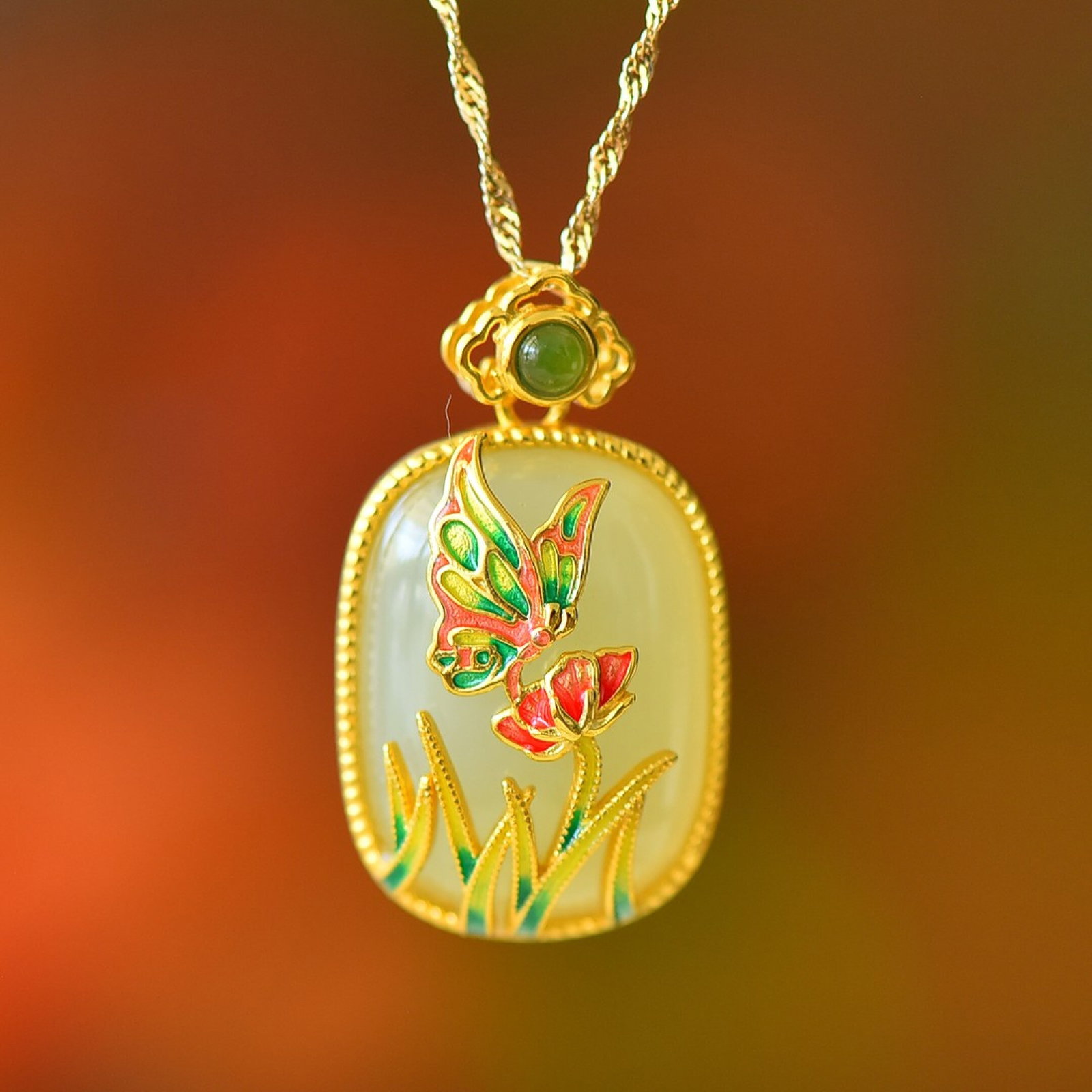 An Exquisite Sterling Silver-Gold Plated Inlaid White Jade Enamel Pendant: Estimated Value:300-600 An Exquisite Sterling Silver-Gold Plated Inlaid White Jade Enamel Pendant 纯银镀金镶白玉珐琅吊坠