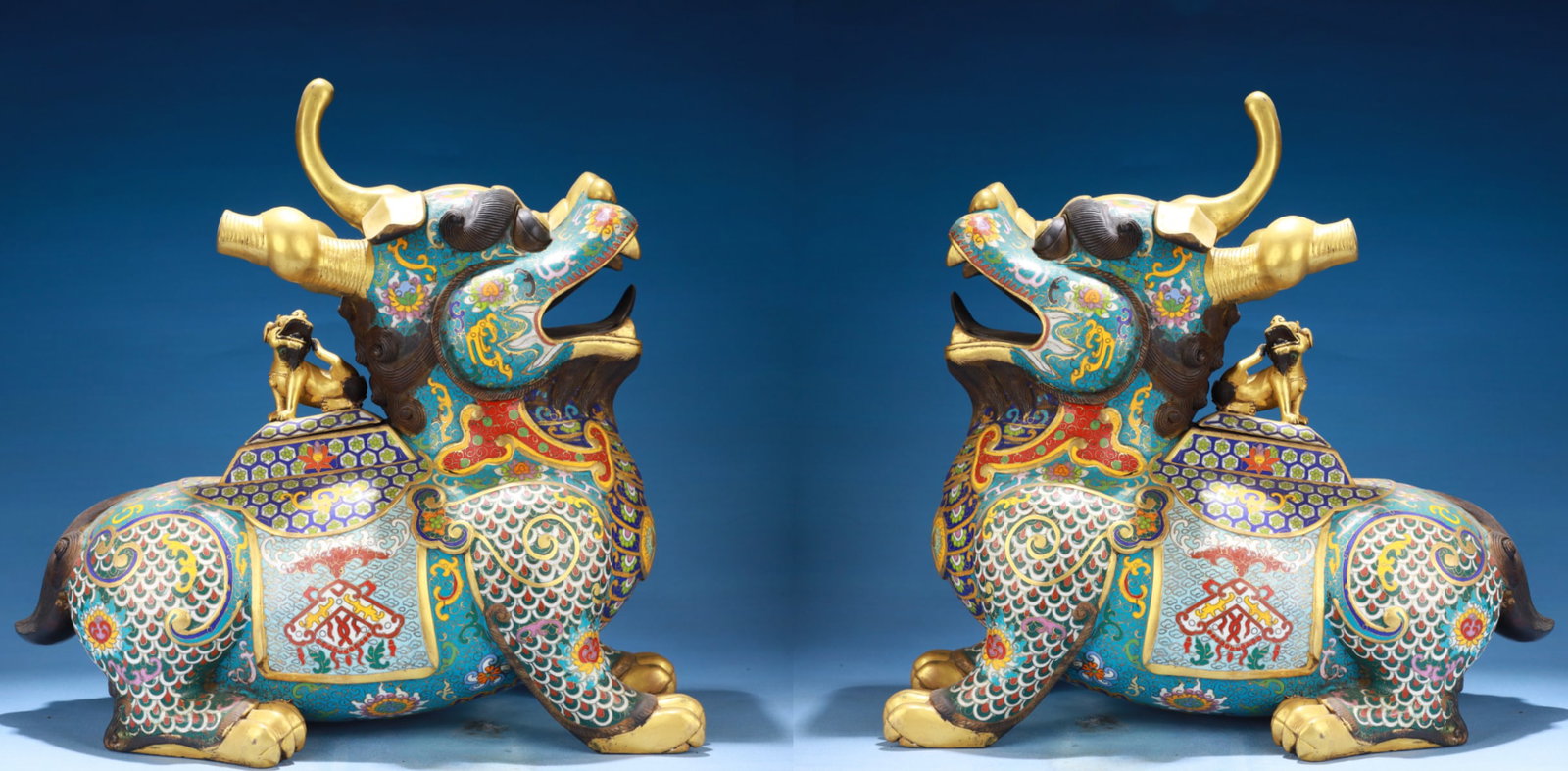 A Pair of Exquisite Cloisonne Lotus Pattern Kylin Ornament: Estimated Value:15000-30000 A Pair of Exquisite Cloisonne Lotus Pattern Kylin Ornament,Qing Dynasty,China,Qianlong Six-character Mark,Size:13.4inx6.7inx15.4in,Weight:11500g