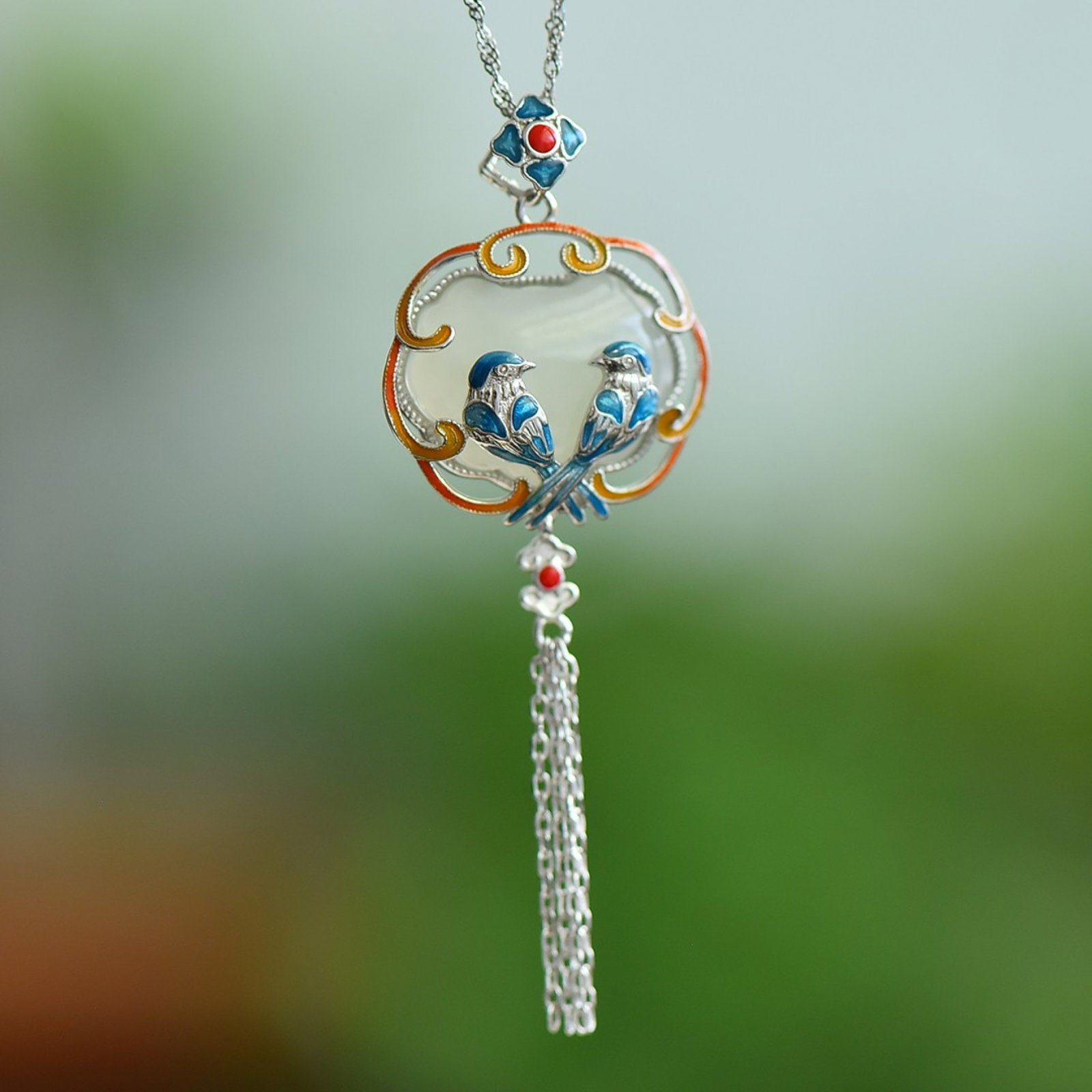 An Exquisite Sterling Silver Inlaid White Jade Enamel Pendant: Estimated Value:300-600 An Exquisite Sterling Silver Inlaid White Jade Enamel Pendant,Size:16mmx21mm 纯银镶白玉珐琅吊坠