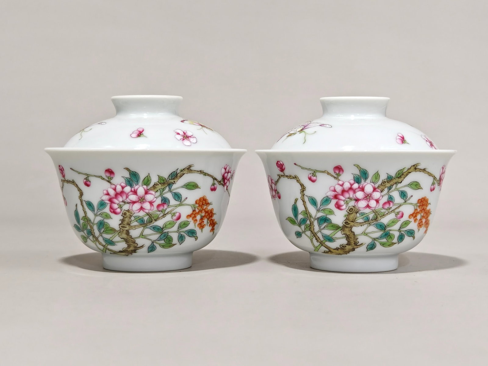 A Pair of Exquisite Famille-Rose Flower and Butterfly Pattern Cover Bowls: Estimated Value:3000-6000 A Pair of Exquisite Famille-Rose Flower and Butterfly Pattern Cover Bowls,Qing Dynasty,China,Yongzheng Four-character Mark,Size:3.5inx3.9in