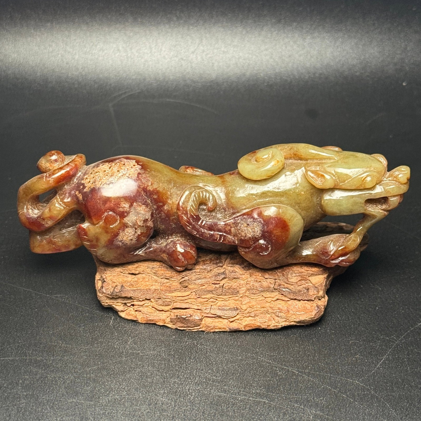 An Exquisite Archaic Jade Auspicious Beast Ornament: Estimated Value:360-800 An Exquisite Archaic Jade Auspicious Beast Ornament,Ancient Time,China,Size:120mmx35mmx35mm,Weight:157g