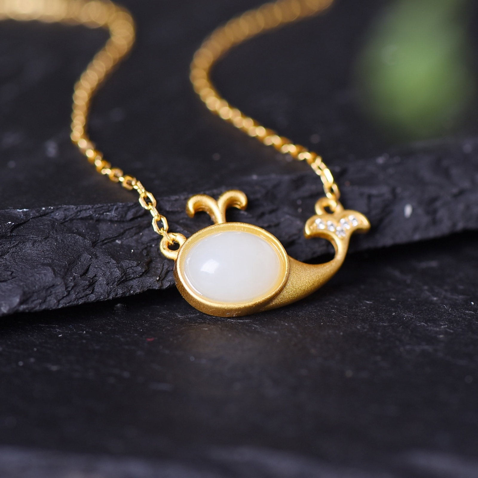 An Exquisite Sterling Silver-Gold Plated Inlaid White Jade Pendant: Estimated Value:200-400 An Exquisite Sterling Silver-Gold Plated Inlaid White Jade Pendant,Size:8mmx10mm 纯银镀金镶白玉吊坠