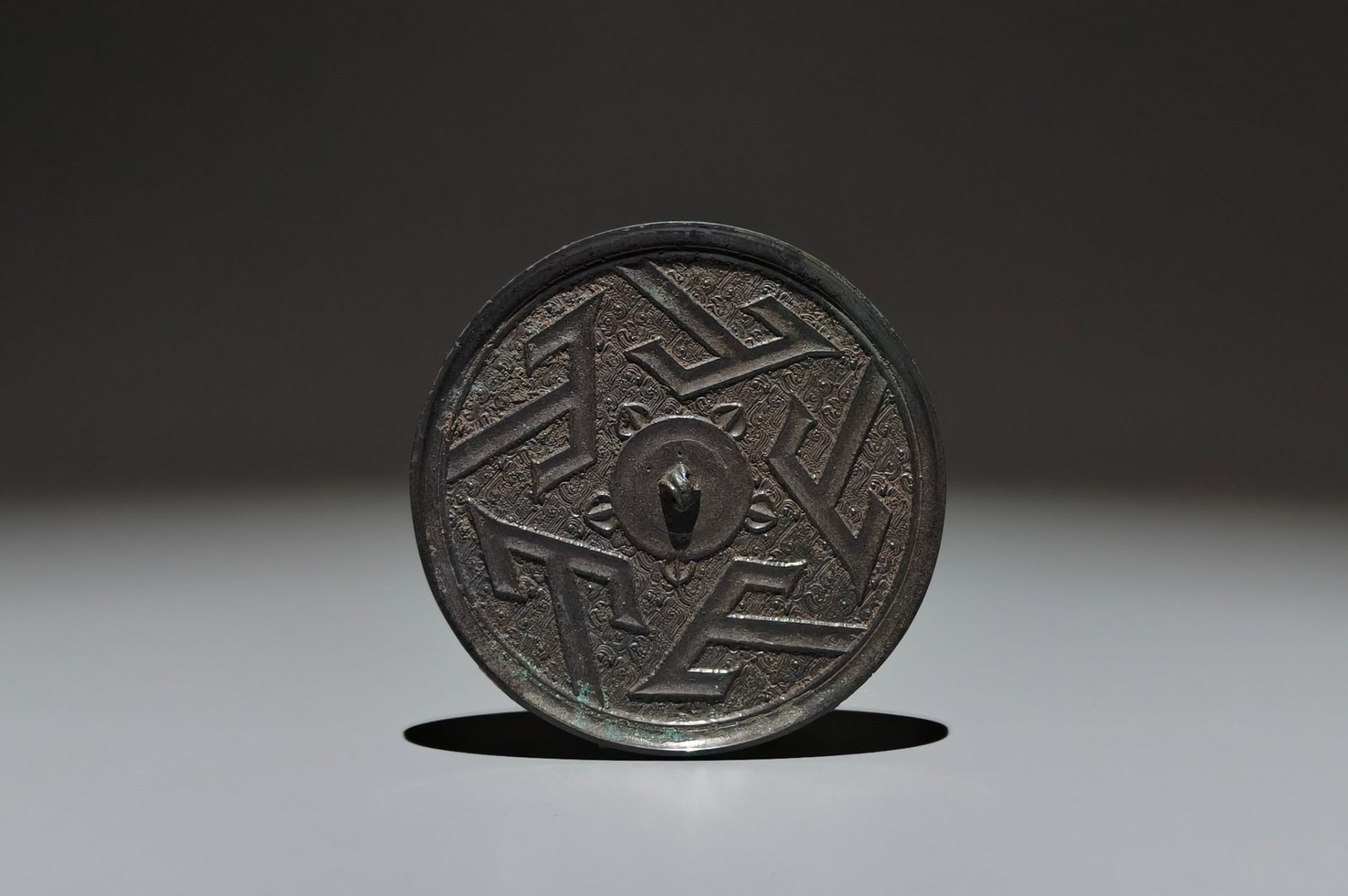 An Archaic Bronze Shan-Character Pattern Mirror: Estimated Value:600-1200 An Archaic Bronze Shan-Character Pattern Mirror,the Warring States period in China,Size:3.8in 青铜山字纹镜子,中国战