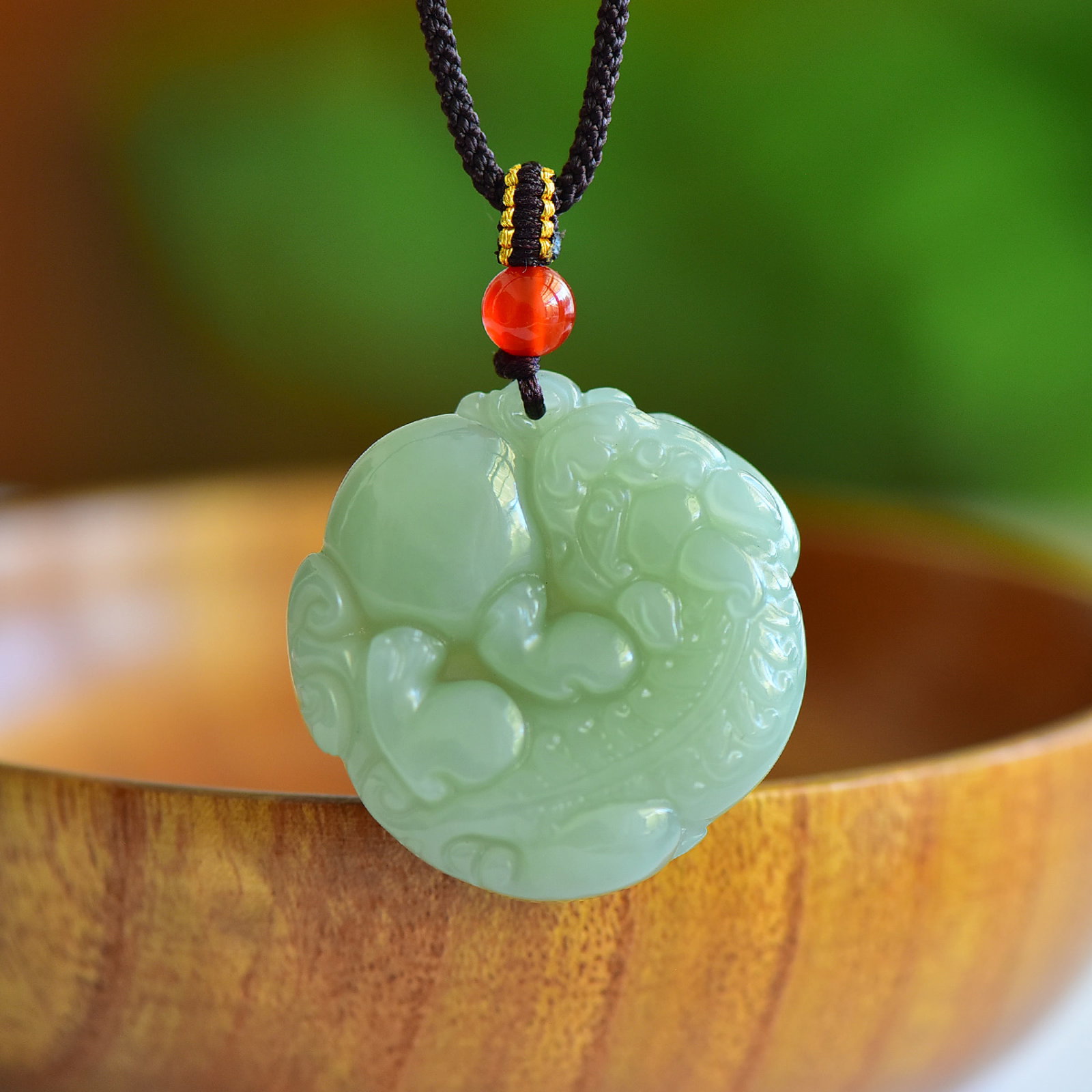 An Exquisite Greenish Jade Auspicious Beast Pendant: Estimated Value:600-1200 An Exquisite Greenish Jade Auspicious Beast Pendant,Size:35mmx35mm