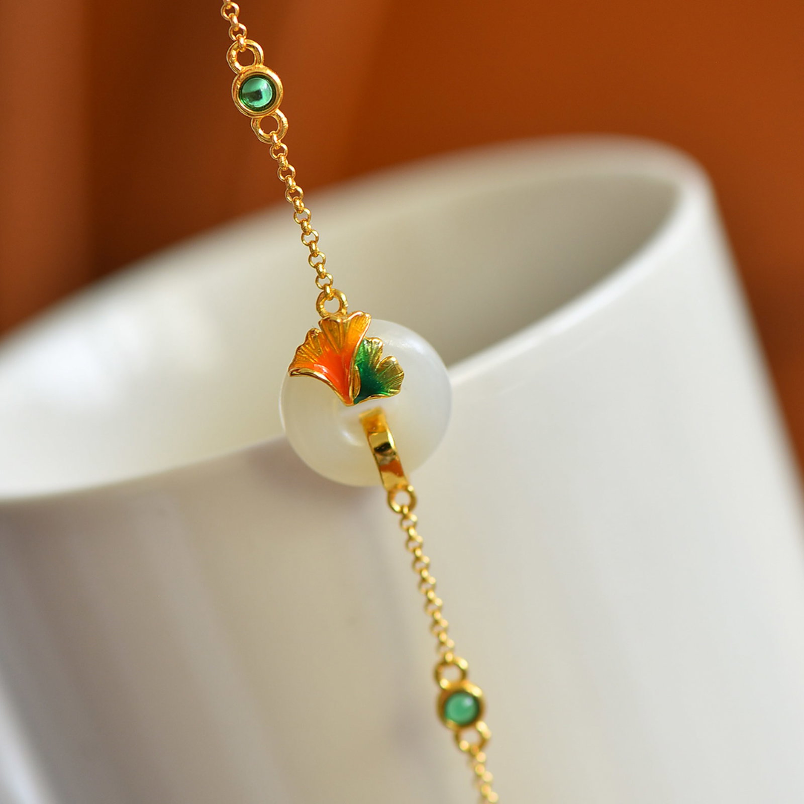 An Exquisite Sterling Silver-Gold Plated Inlaid White Jade Bracelet: Estimated Value:200-400 An Exquisite Sterling Silver-Gold Plated Inlaid White Jade Bracelet,Size:15mmx15mm 纯银镀金镶白玉手链