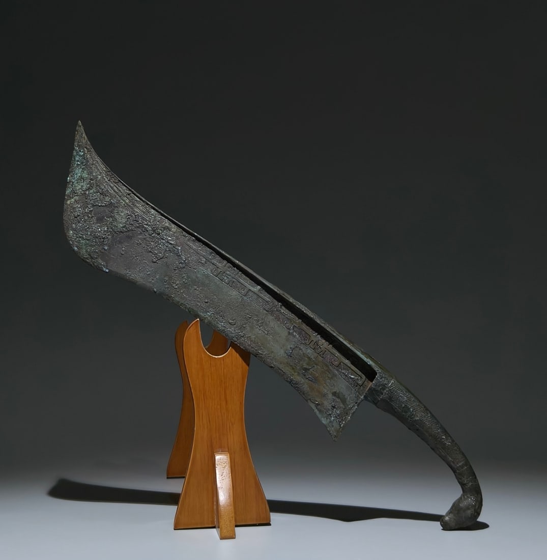 An Archaic Bronze Thunder and Cloud Pattern Machete: Estimated Value:1800-3600 An Archaic Bronze Thunder and Cloud Pattern Machete,the Warring States period in China,Size:18.1inx10.6inx1in
