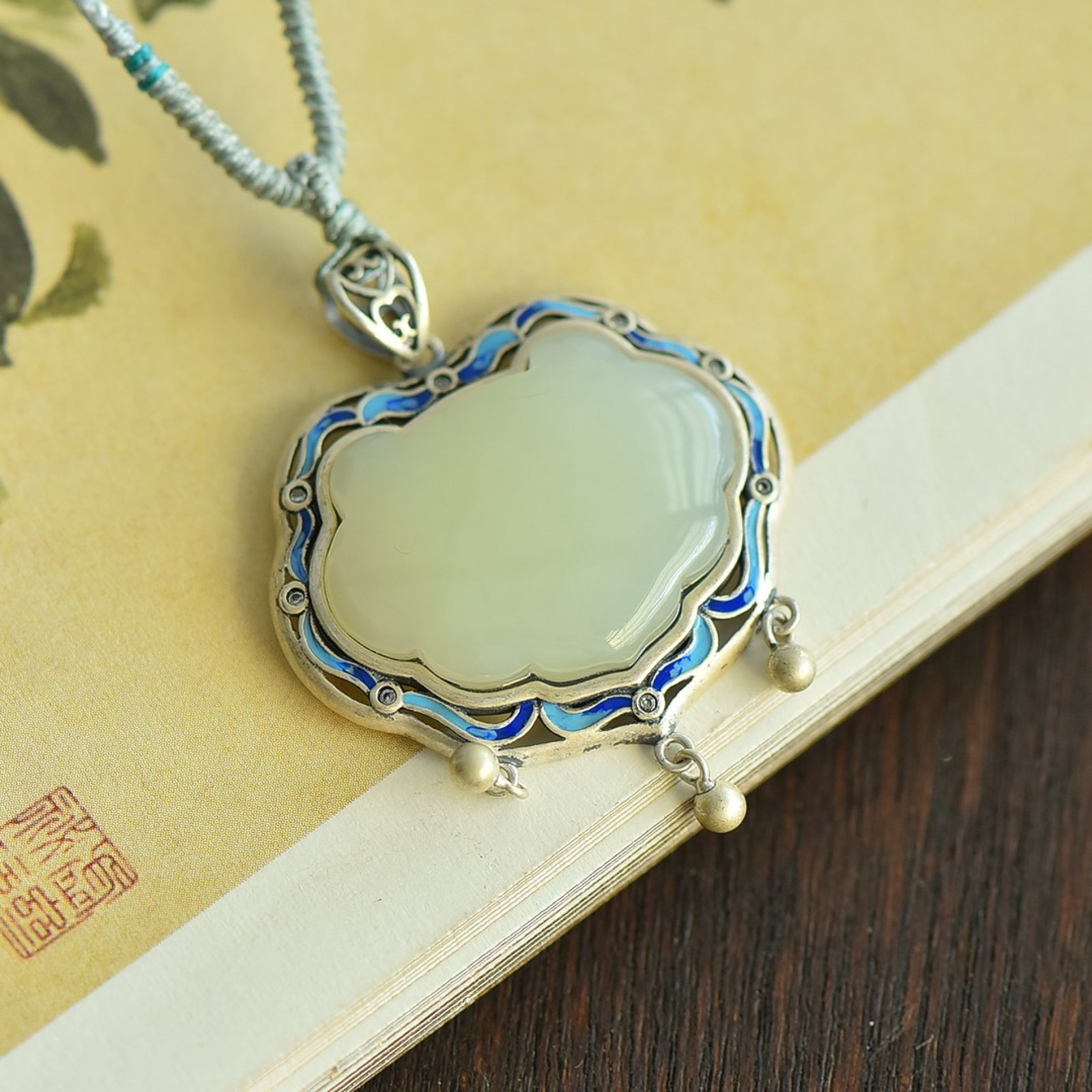 An Exquisite Sterling Silver-Gold Plated Inlaid White Jade Enamel Pendant: Estimated Value:400-800 An Exquisite Sterling Silver-Gold Plated Inlaid White Jade Enamel Pendant 纯银镶白玉珐琅吊坠
