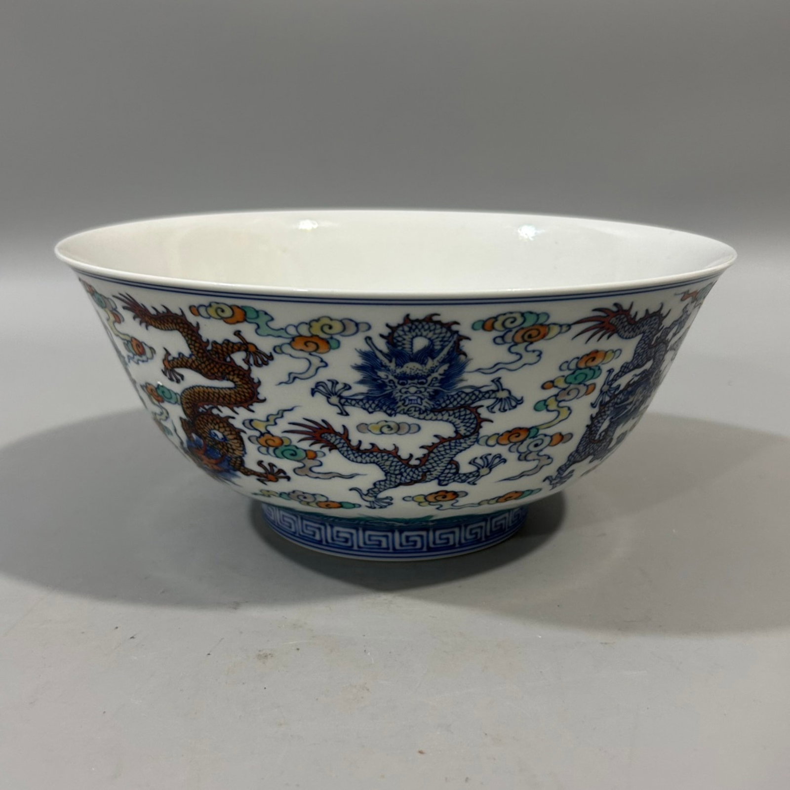 An Exquisite Doucai Auspicious Cloud and Dragon Pattern Bowl: Estimated Value:1760-3600 An Exquisite Doucai Auspicious Cloud and Dragon Pattern Bowl,Qing Dynasty,China,Qianlong Six-character Mark,Size:3.9inx8.7in