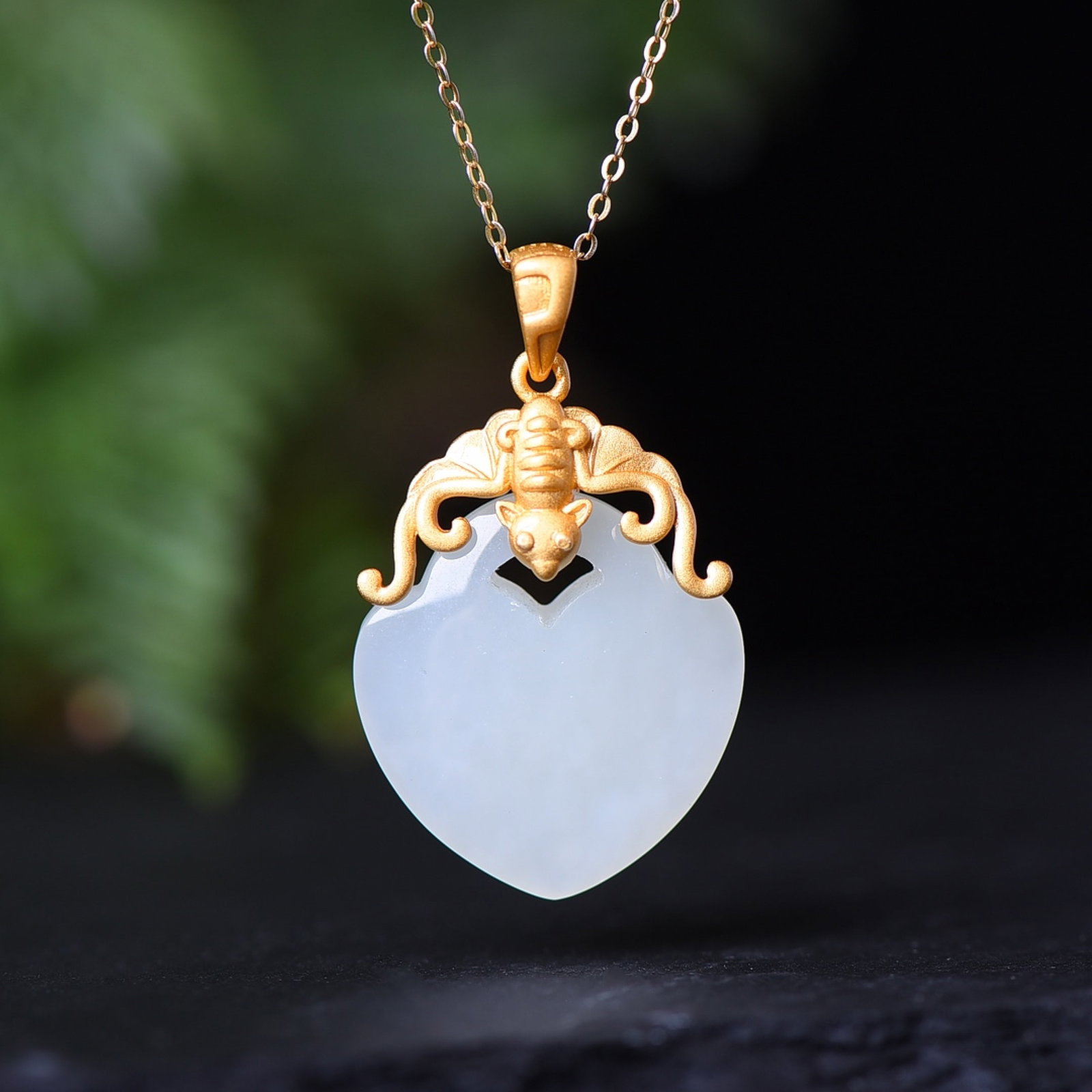 An Exquisite Sterling Silver-Gold Plated Inlaid White Jade Pendant: Estimated Value:400-800 An Exquisite Sterling Silver-Gold Plated Inlaid White Jade Pendant,Size:22mmx23mm 纯银镀金镶白玉吊坠