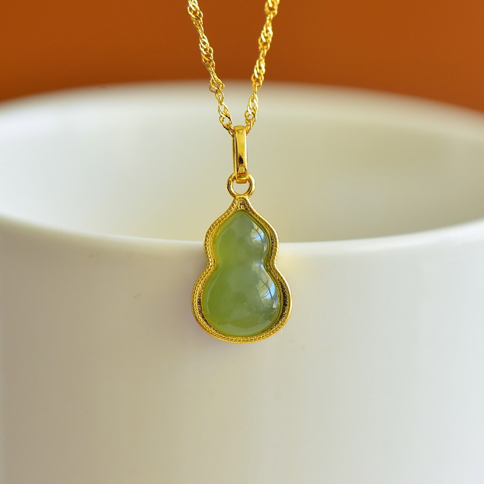 An Exquisite Sterling Silver-Gold Plated Inlaid Jasper Gourd Pendant: Estimated Value:200-400 An Exquisite Sterling Silver-Gold Plated Inlaid Jasper Gourd Pendant,Size:8mmx13mm