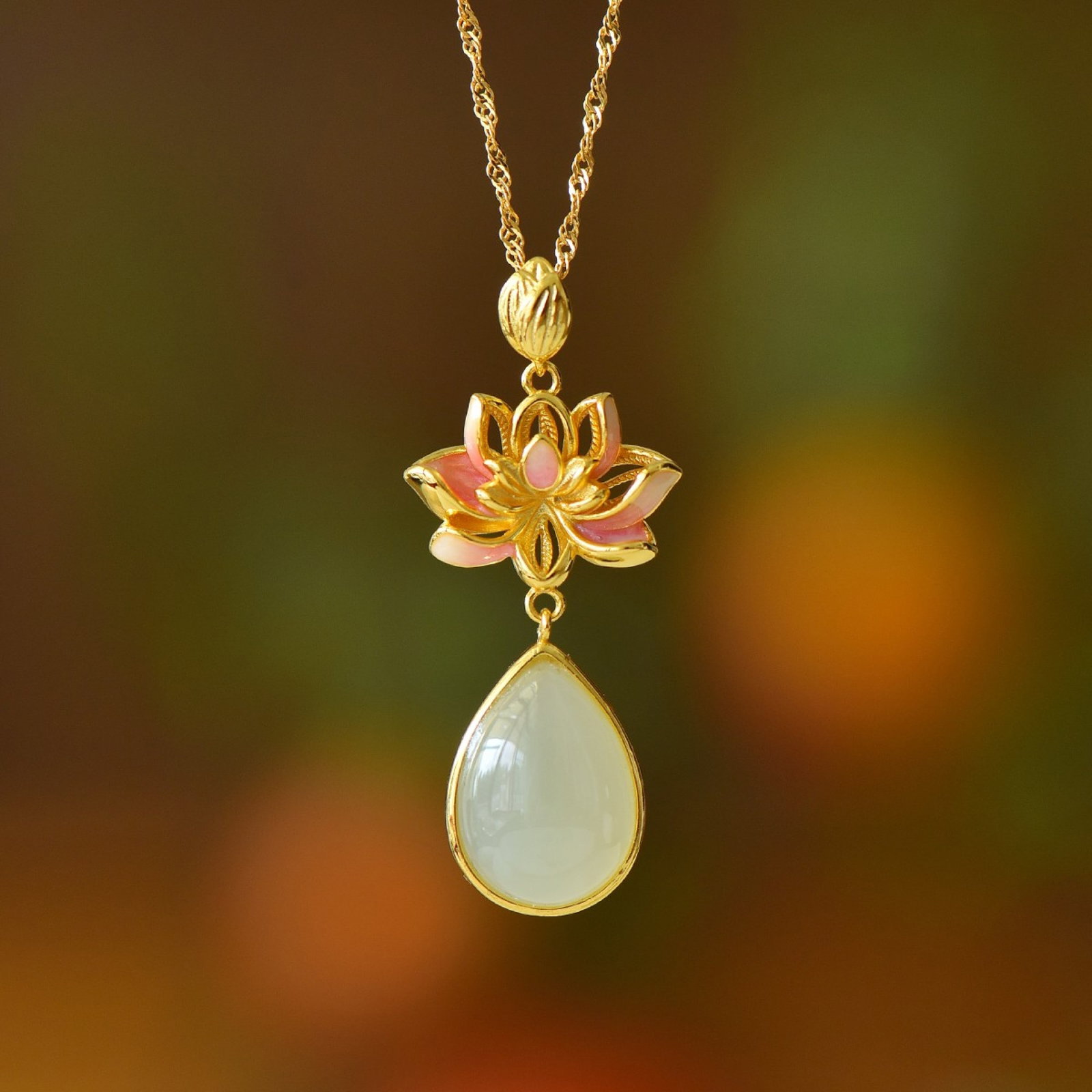 An Exquisite Sterling Silver-Gold Plated Inlaid White Jade Pendant: Estimated Value:200-400 An Exquisite Sterling Silver-Gold Plated Inlaid White Jade Pendant,Size:10mmx14mm 纯银镀金镶白玉吊坠