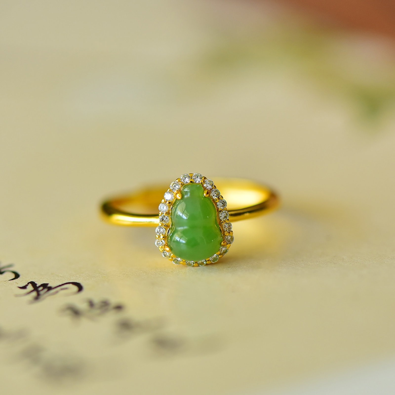 An Exquisite Sterling Silver-Gold Plated Inlaid Jasper Gourd Ring,Inlaid Diamond: Estimated Value:200-400 An Exquisite Sterling Silver-Gold Plated Inlaid Jasper Gourd Ring,Inlaid Diamond,Size:6mmx8mm
