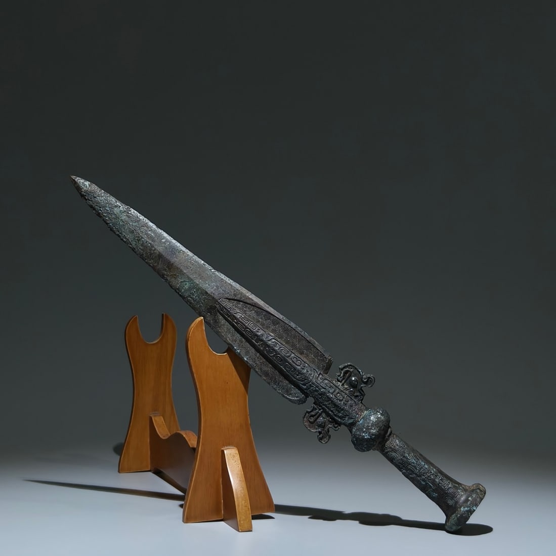 An Archaic Bronze Thunder and Cloud Pattern Sword: Estimated Value:1600-3200 An Archaic Bronze Thunder and Cloud Pattern Sword,the Warring States period in China,Size:17.1inx2.6inx1.9in