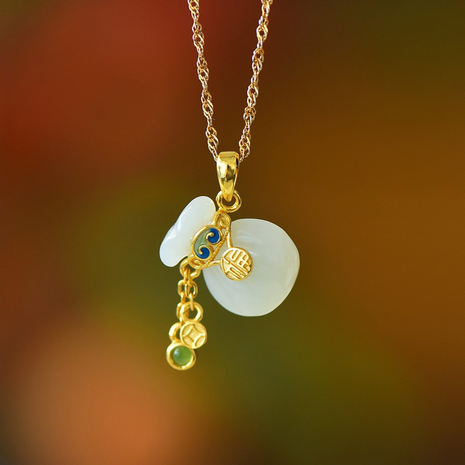 An Exquisite Sterling Silver-Gold Plated Inlaid White Jade Pendant: Estimated Value:200-400 An Exquisite Sterling Silver-Gold Plated Inlaid White Jade Pendant,Size:12mmx16mm 纯银镀金镶白玉吊坠