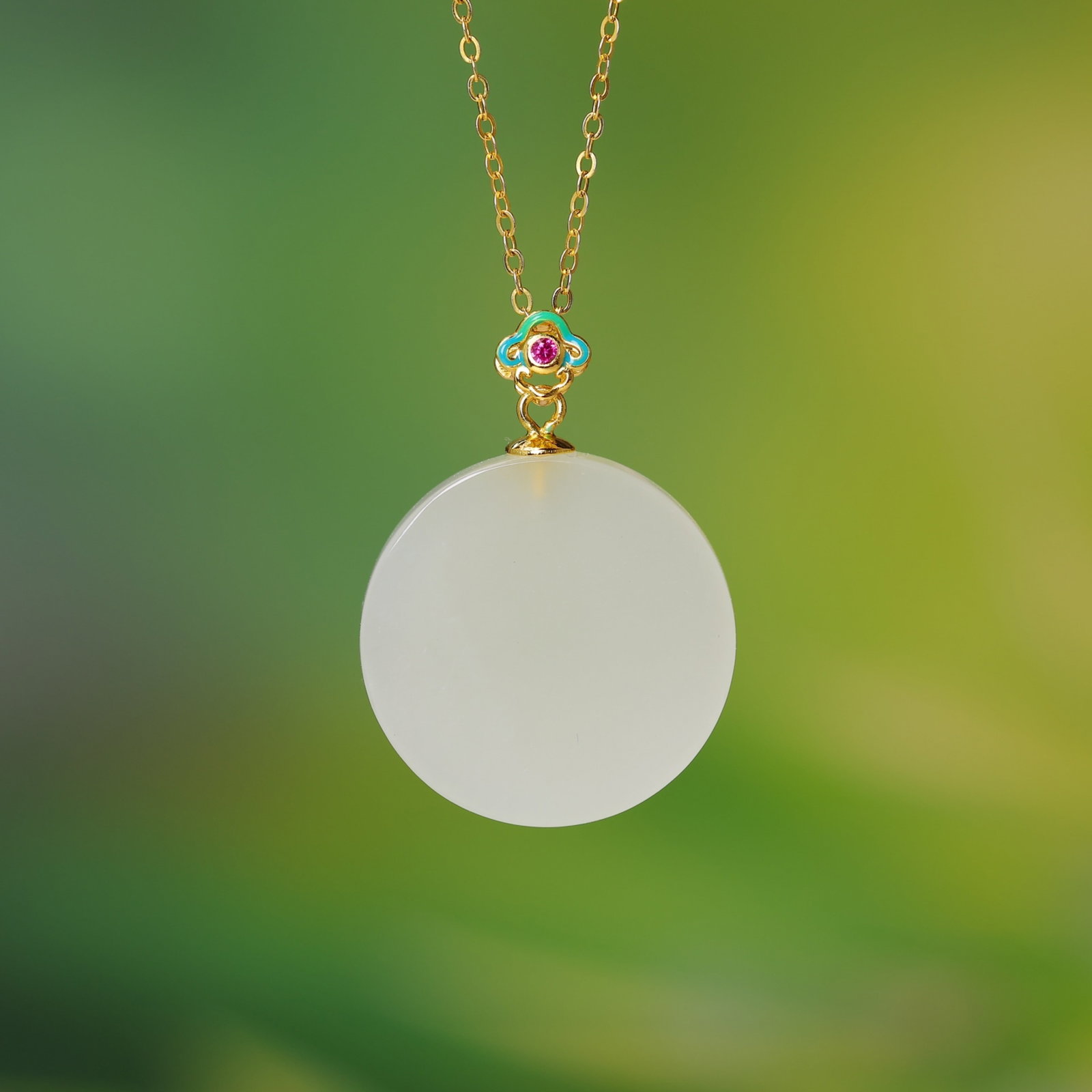 An Exquisite Sterling Silver-Gold Plated Inlaid White Jade Pendant: Estimated Value:400-800 An Exquisite Sterling Silver-Gold Plated Inlaid White Jade Pendant,Size:22mmx22mm 纯银镀金镶白玉吊坠