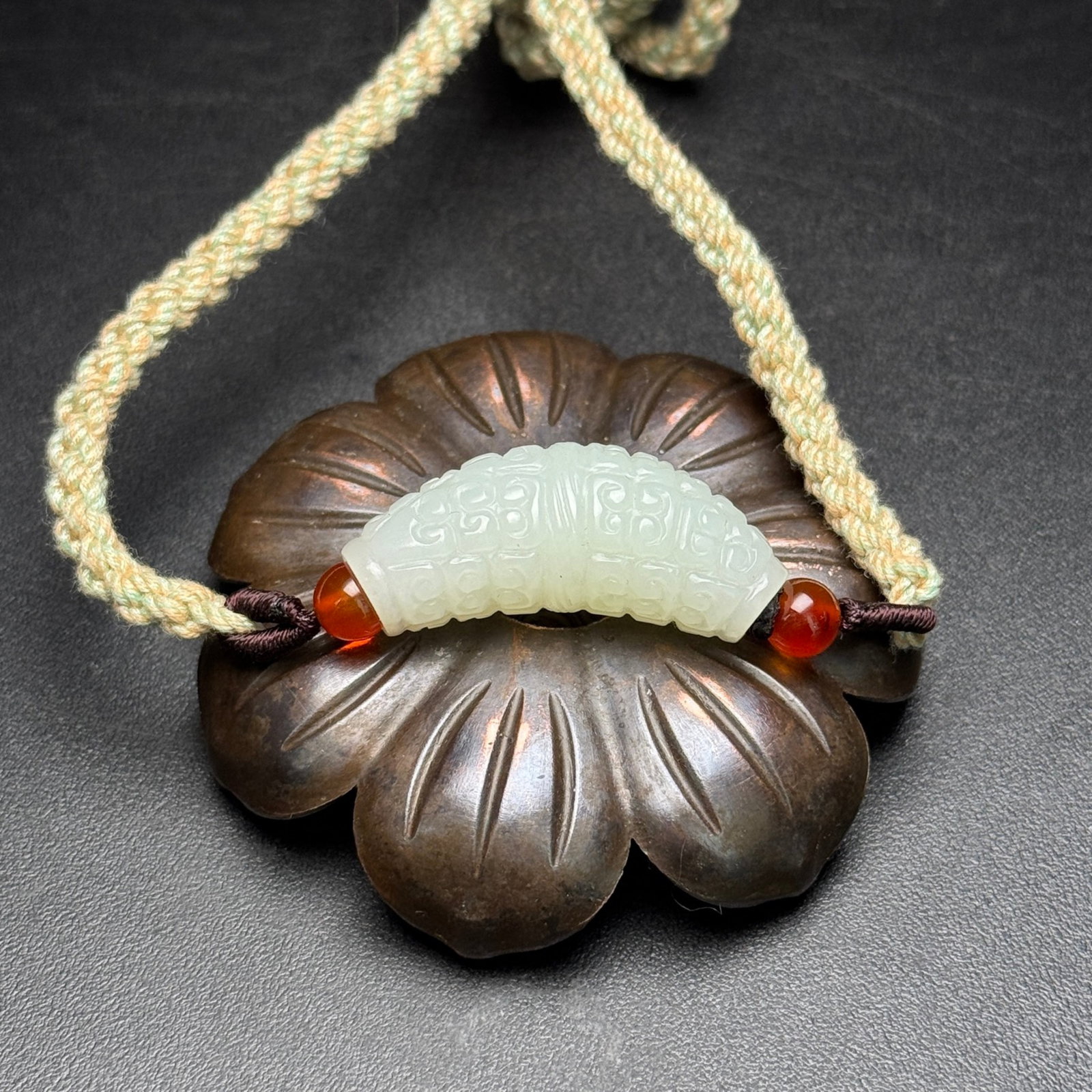An Exquisite White Jade Ruyi Pattern Pendant: Estimated Value:400-800 An Exquisite White Jade Ruyi Pattern Pendant,Qing Dynasty,China,Size:35mmx12mmx13mm,Weight:14g