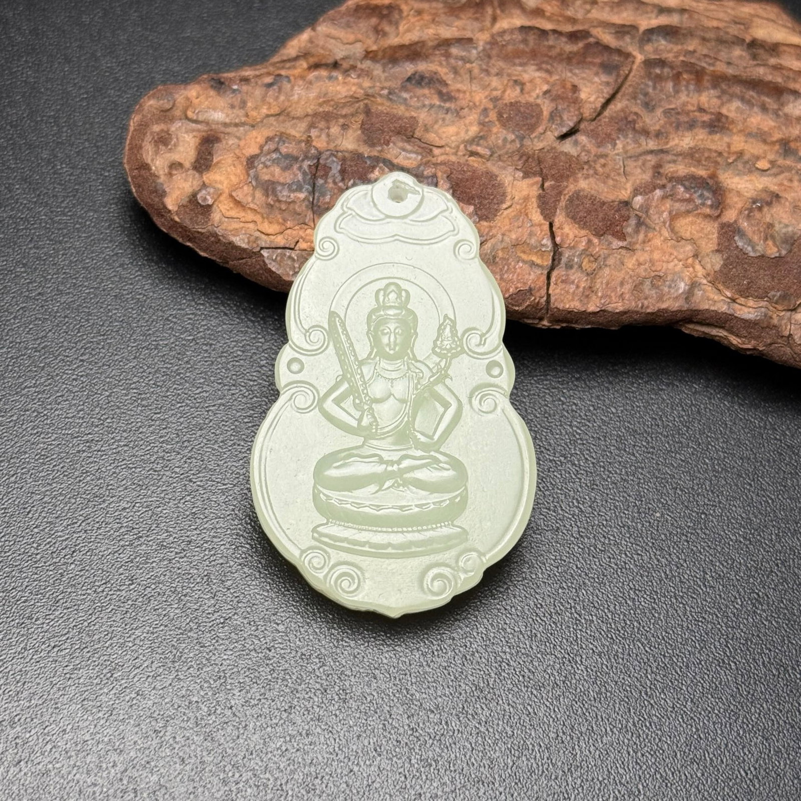 An Exquisite White Jade Statue of Bodhisattva Pattern Pendant: Estimated Value:200-400 An Exquisite White Jade Statue of Bodhisattva Pattern Pendant,Qing Dynasty,China,Size:45mmx28mmx6mm,Weight:13g