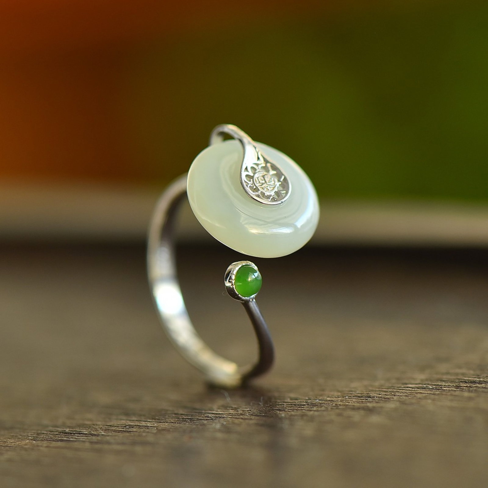 An Exquisite Sterling Silver Inlaid White Jade Enamel Ring: Estimated Value:200-400 An Exquisite Sterling Silver Inlaid White Jade Enamel Ring 纯银镶白玉珐琅戒指