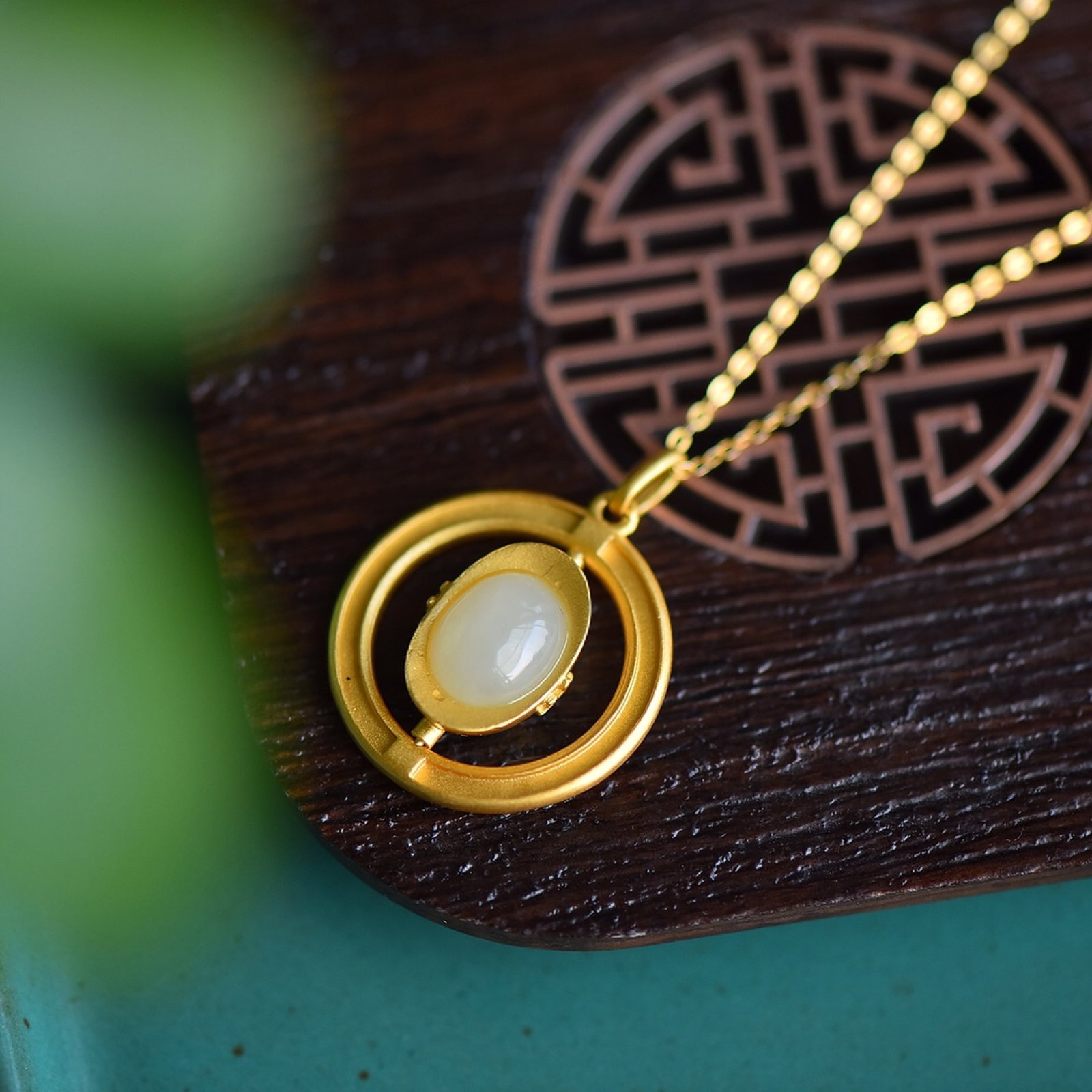 An Exquisite Sterling Silver-Gold Plated Inlaid White Jade Pendant: Estimated Value:200-400 An Exquisite Sterling Silver-Gold Plated Inlaid White Jade Pendant 纯银镀金镶白玉吊坠