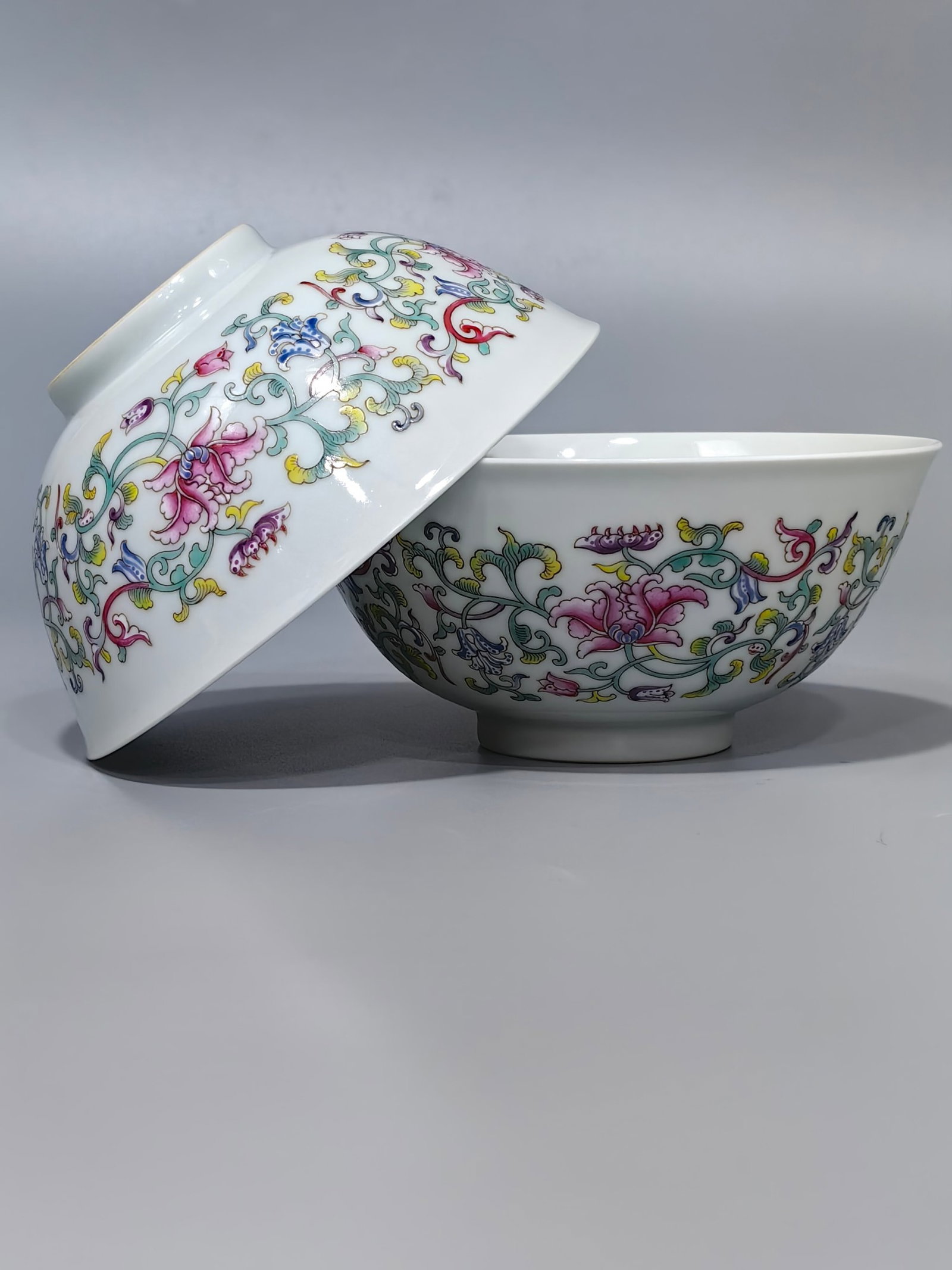 A Pair of Exquisite Famille-Rose Lotus Pattern Bowls: Estimated Value:2000-4000 A Pair of Exquisite Famille-Rose Lotus Pattern Bowls,Qing Dynasty,China,Qianlong Four-character Mark,Size:2.7inx5.9in
