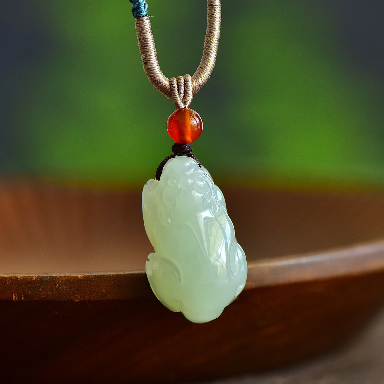 An Exquisite Greenish Jade Auspicious Beast Pendant: Estimated Value:300-600 An Exquisite Greenish Jade Auspicious Beast Pendant,Size:30mmx17mm 寓意:招财纳福 避邪。
