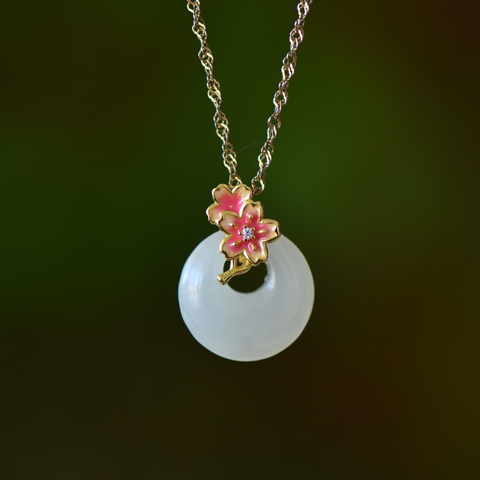 An Exquisite Sterling Silver-Gold Plated Inlaid White Jade Pendant: Estimated Value:200-400 An Exquisite Sterling Silver-Gold Plated Inlaid White Jade Pendant,Size:15mmx15mm 纯银镀金镶白玉吊坠