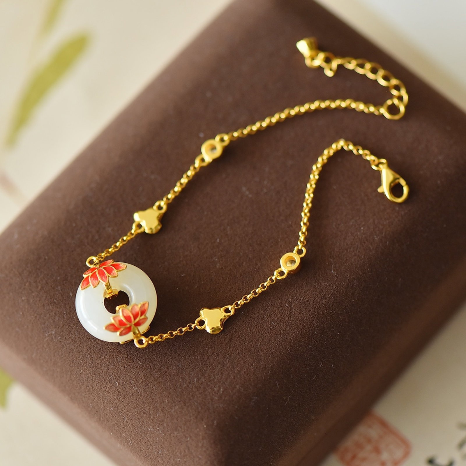 An Exquisite Sterling Silver-Gold Plated Inlaid White Jade Enamel Bracelets: Estimated Value:400-800 An Exquisite Sterling Silver-Gold Plated Inlaid White Jade Enamel Bracelets,Size:15mmx15mm