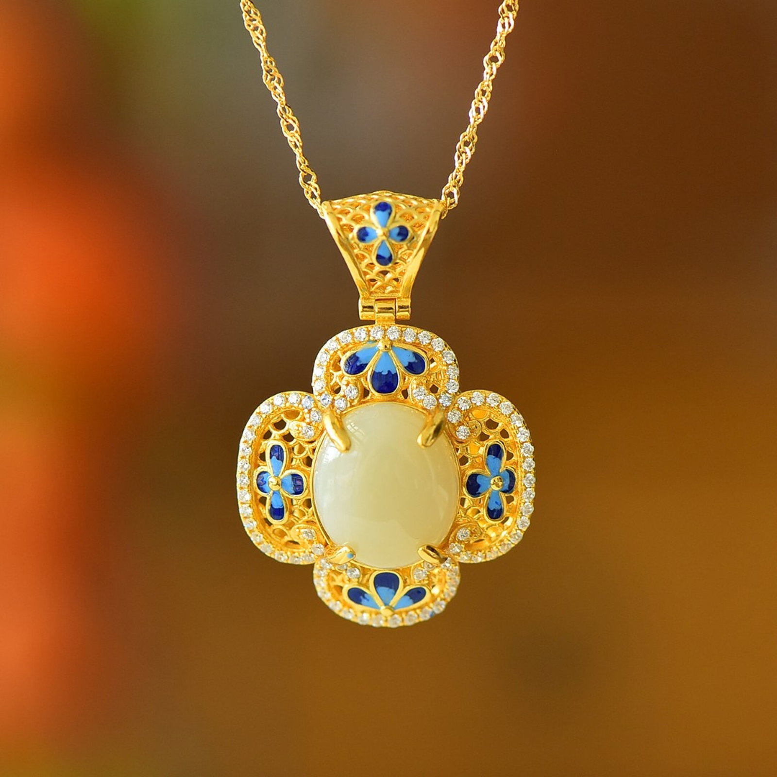 An Exquisite Sterling Silver-Gold Plated Inlaid White Jade Enamel Pendant: Estimated Value:300-600 An Exquisite Sterling Silver-Gold Plated Inlaid White Jade Enamel Pendant,Size:12mmx14mm