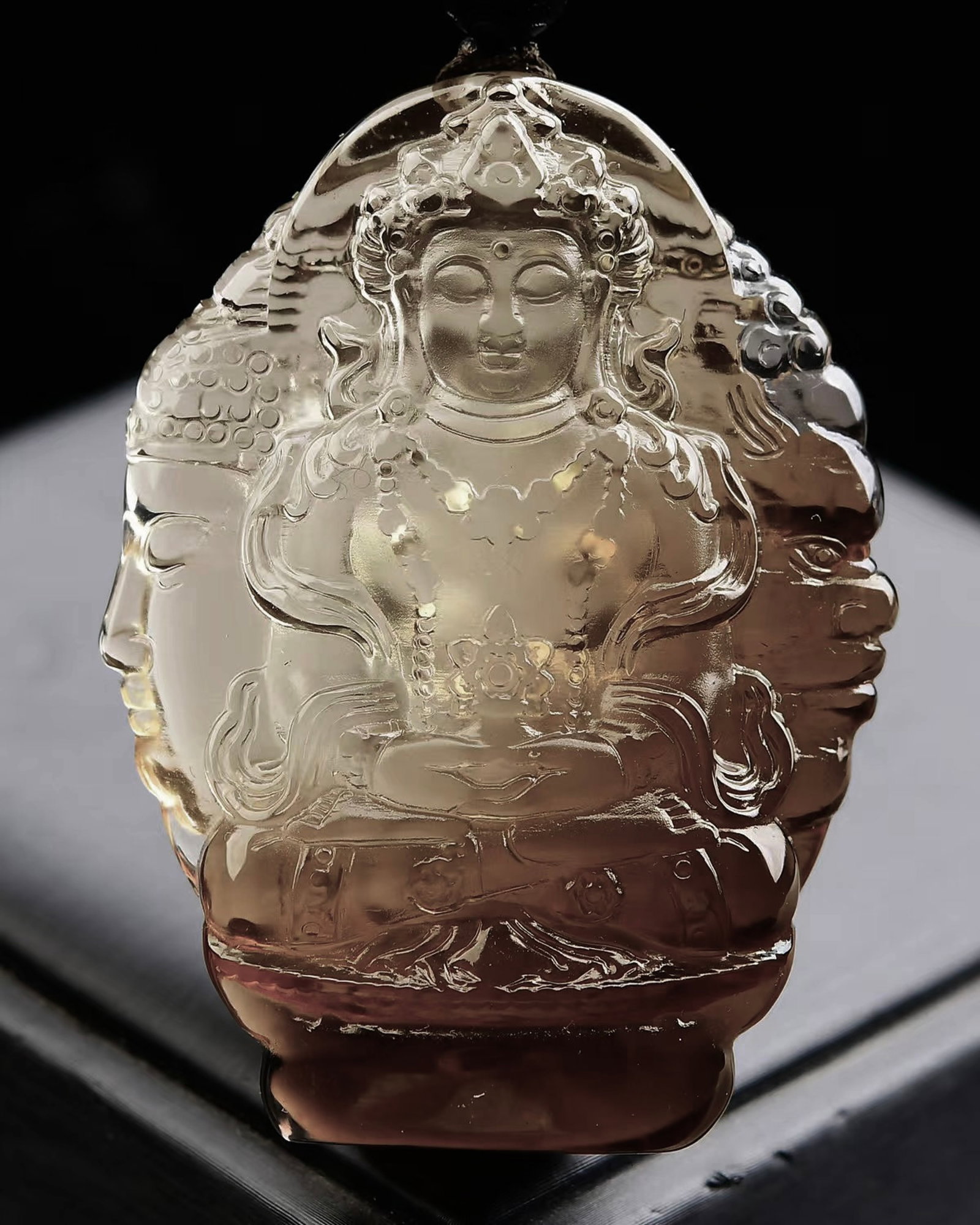 An Exquisite Crystal Statue of Avalokitesvara Pattern Pendant: Estimated Value:1800-3600 An Exquisite Crystal Statue of Avalokitesvara Pattern Pendant,Size:65mmx46mmx14mm,Weight:76.3g