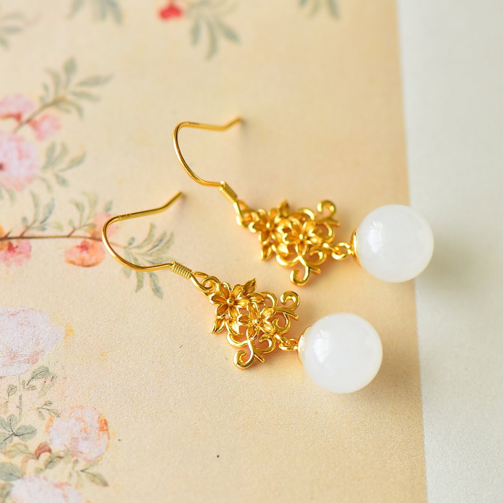 A Pair of Exquisite Sterling Silver-Gold Plated Inlaid White Jade Enamel Earrings: Estimated Value:200-400 A Pair of Exquisite Sterling Silver-Gold Plated Inlaid White Jade Enamel Earrings,Size:10mmx10mm
