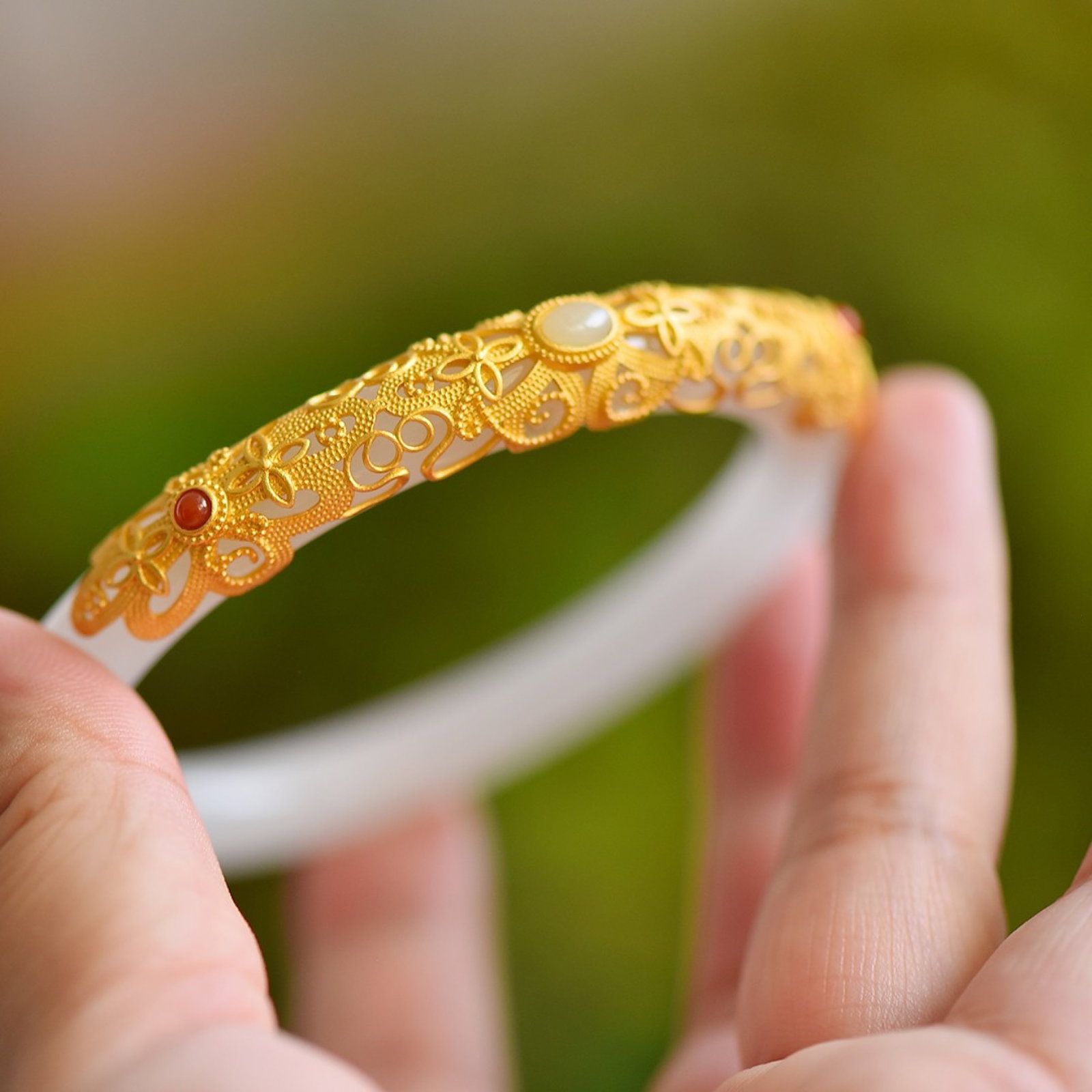 An Exquisite Sterling Silver-Gold Plated Inlaid White Jade Bracelets: Estimated Value:520-1040 An Exquisite Sterling Silver-Gold Plated Inlaid White Jade Bracelets,Size:54mm-64mm 纯银镀金镶白玉手镯