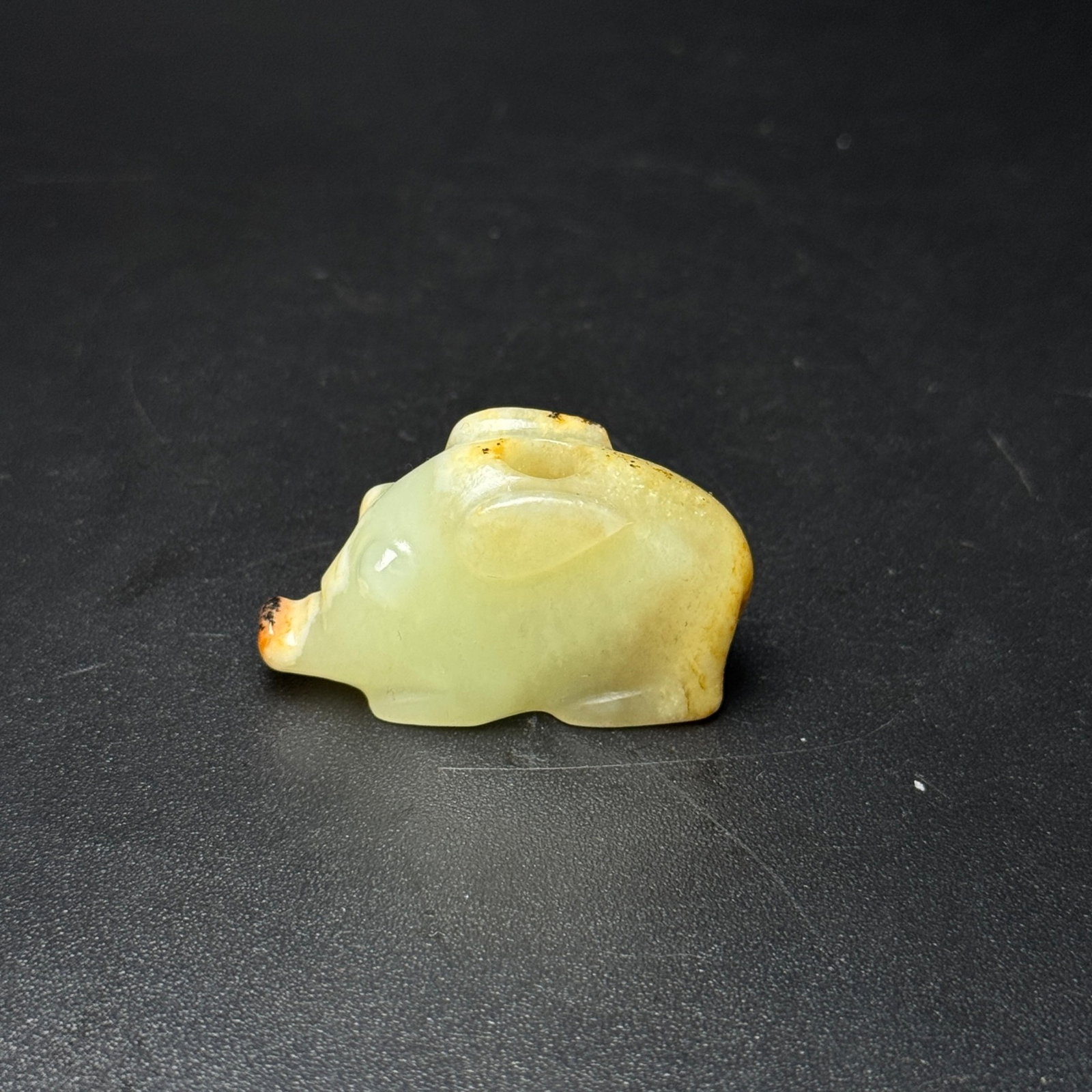 An Exquisite White Jade Pig Pendant: Estimated Value:300-600 An Exquisite White Jade Pig Pendant,Qing Dynasty,China,Size:40mmx22mmx15mm,Weight:23g 白玉猪挂件,中国清代